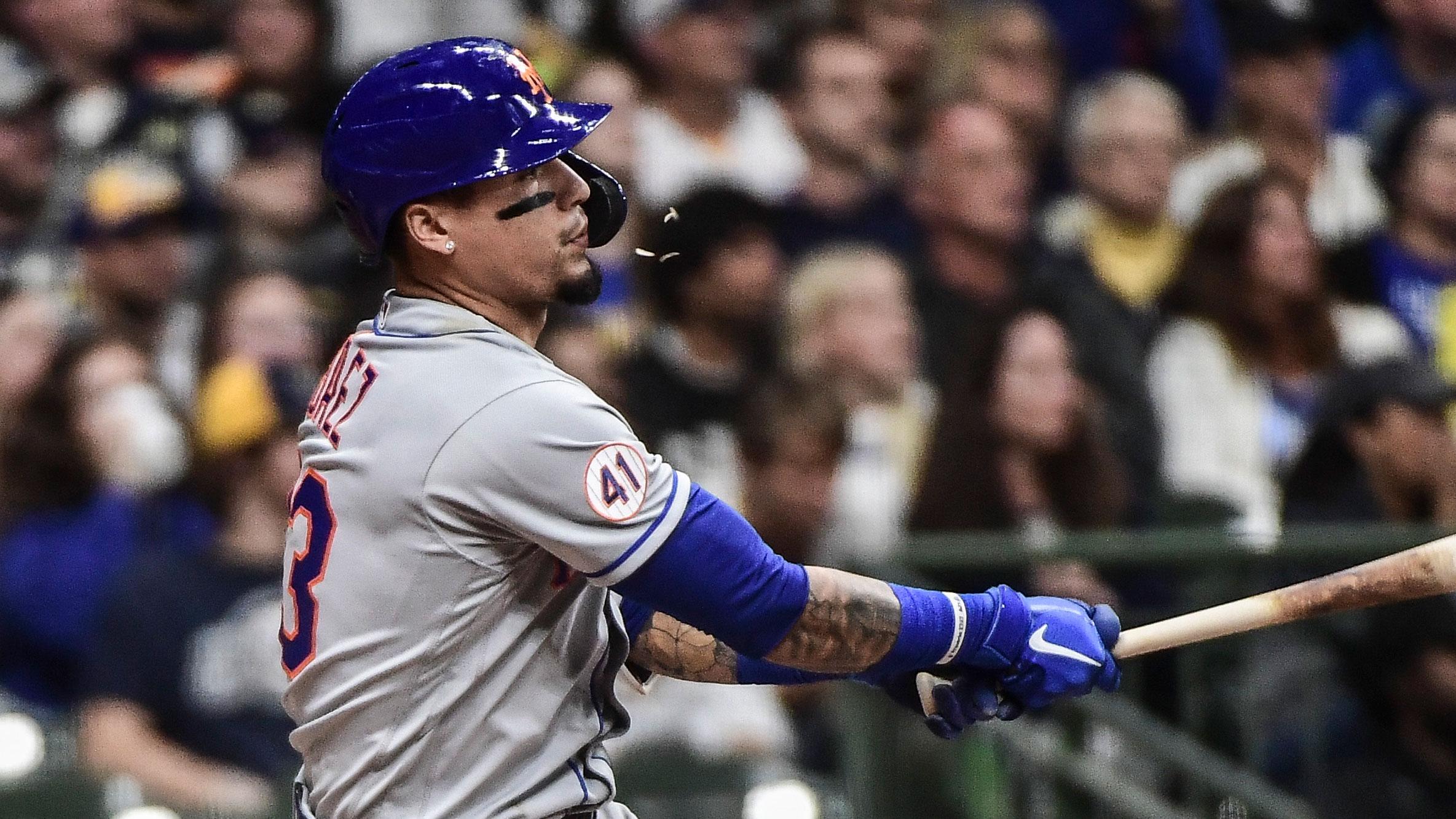 Sep 25, 2021; Milwaukee, Wisconsin, USA; New York Mets shortstop Javier Baez (23) drives in a run with a base hit in the fourth inning against the Milwaukee Brewers at American Family Field.