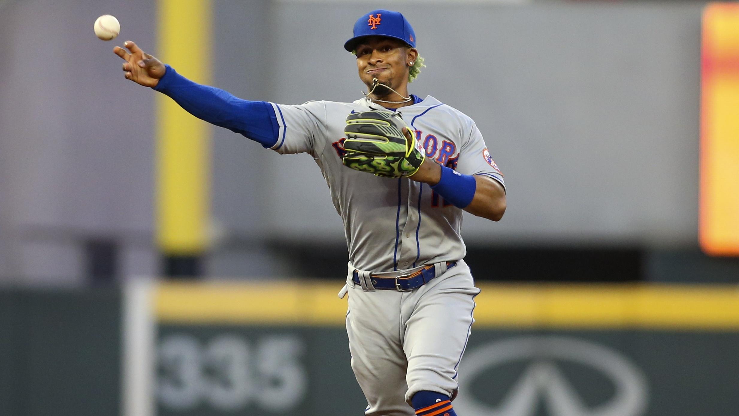 May 19, 2021; Atlanta, Georgia, USA; New York Mets shortstop Francisco Lindor (12) throws a runner out at first against the Atlanta Braves in the fifth inning at Truist Park.