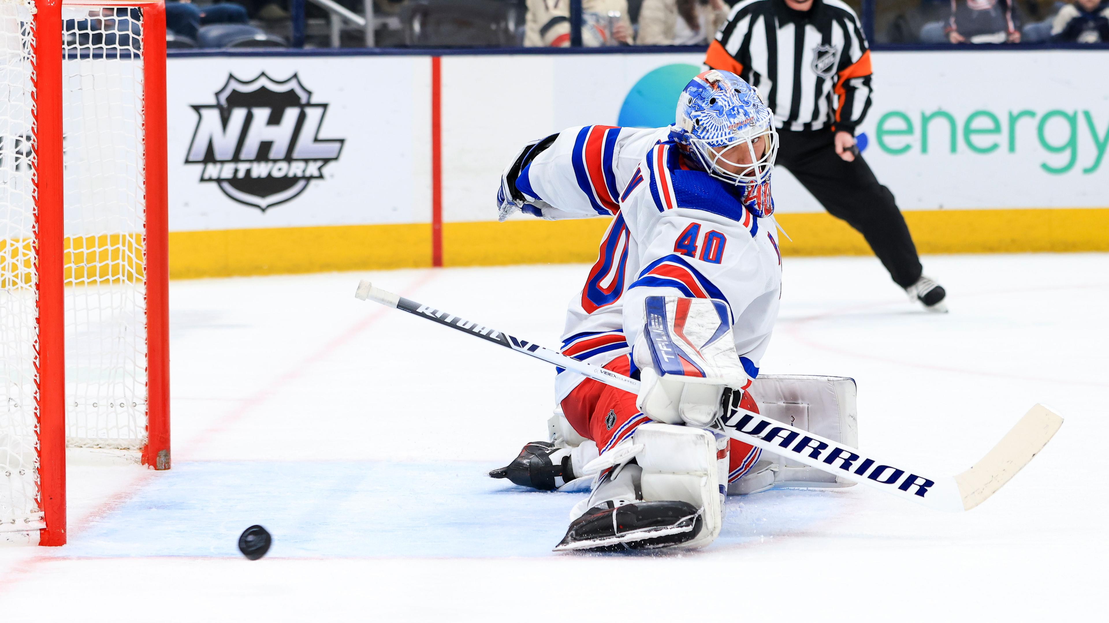 Jan 27, 2022; Columbus, Ohio, USA; New York Rangers goaltender Alexandar Georgiev (40) deflects the puck against the Columbus Blue Jackets in the second period at Nationwide Arena.