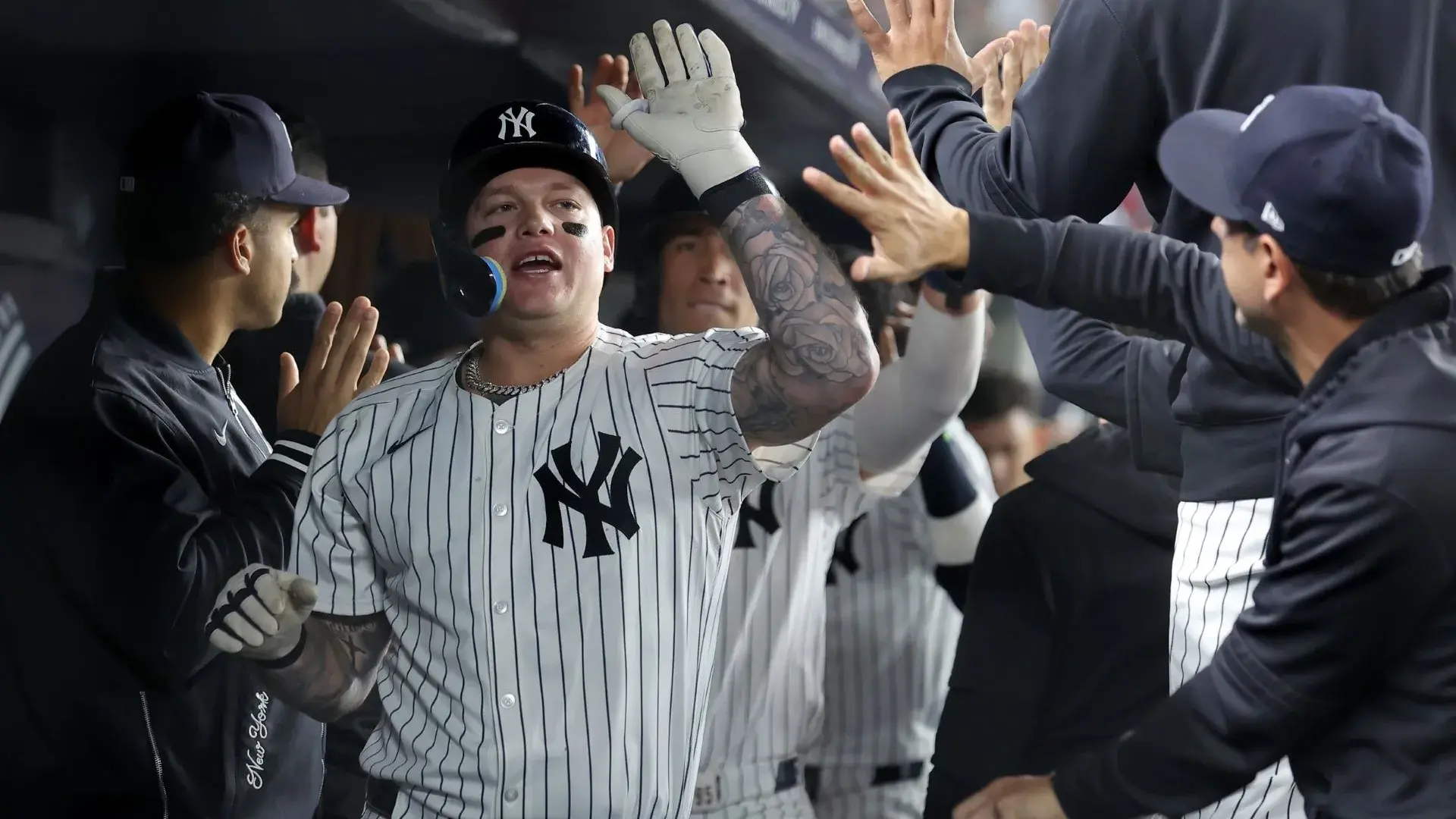 Sep 9, 2024; Bronx, New York, USA; New York Yankees left fielder Alex Verdugo (24) celebrates his two run home run against the Kansas City Royals with teammates in the dugout during the fourth inning at Yankee Stadium. / Brad Penner-Imagn Images