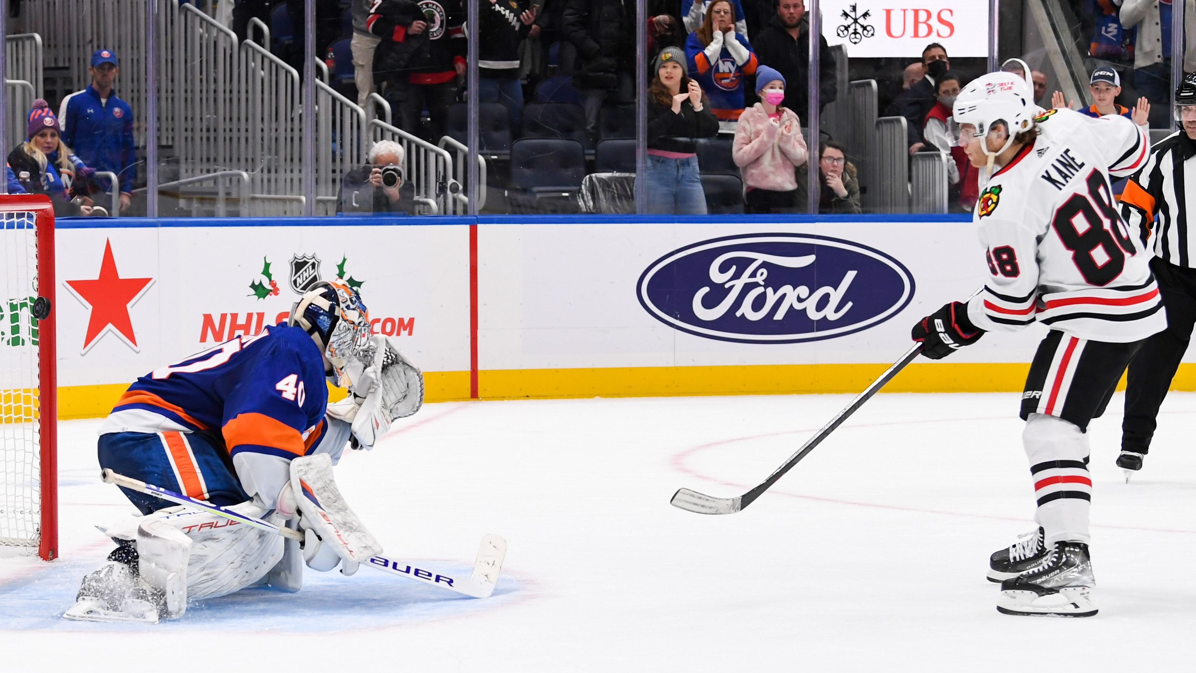 Dec 5, 2021; Elmont, New York, USA; Chicago Blackhawks right wing Patrick Kane (88) scores the wining goal on New York Islanders goaltender Semyon Varlamov (40) during shootouts at UBS Arena. Mandatory Credit: Dennis Schneidler-USA TODAY Sports