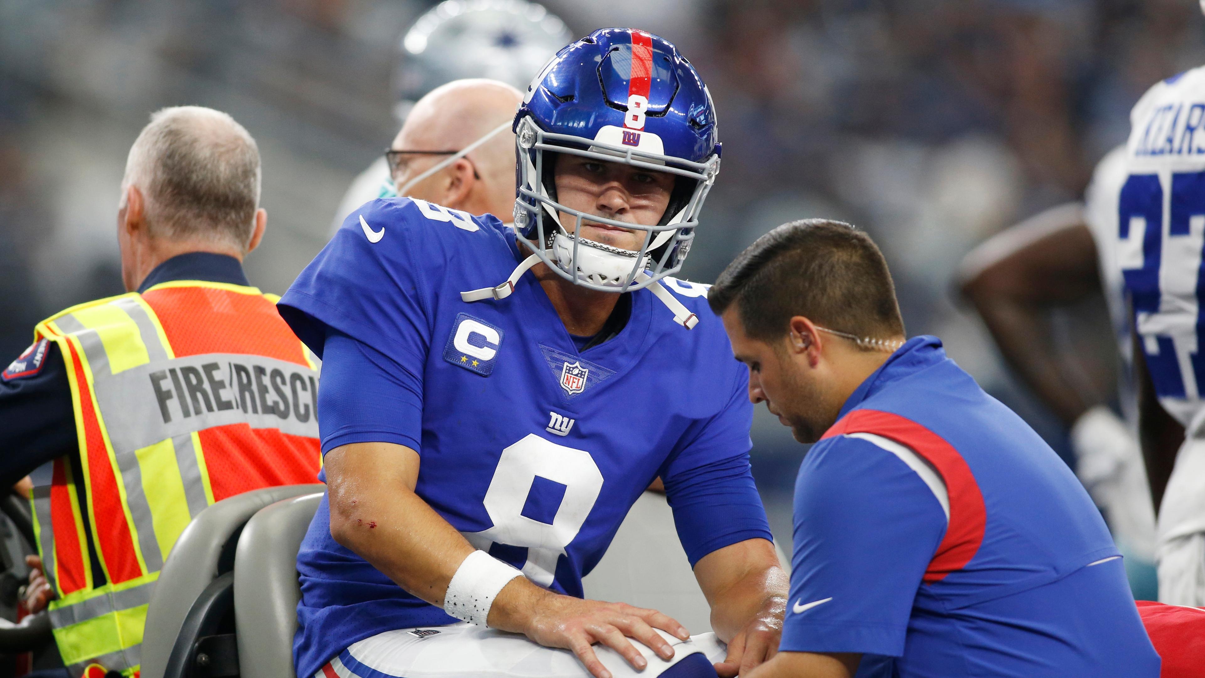 New York Giants quarterback Daniel Jones (8) leaves the field on a cart with an injury in the second quarter against the Dallas Cowboys at AT&T Stadium.