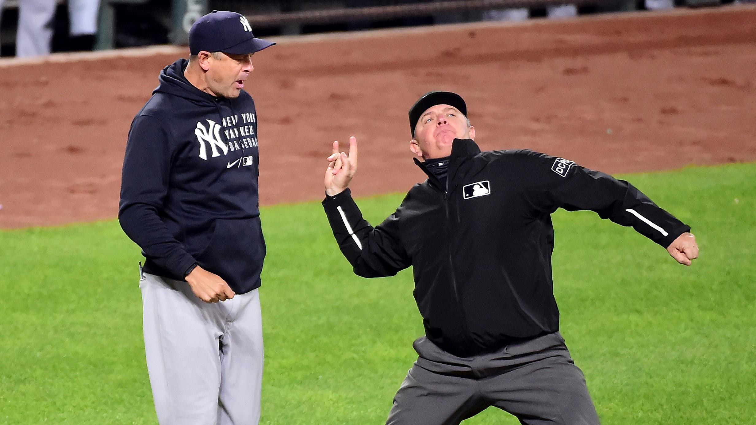 Apr 26, 2021; Baltimore, Maryland, USA; New York Yankees manager Aaron Boone (left) is ejected by umpire Greg Gibson (right) during the eighth inning against the Baltimore Orioles at Oriole Park at Camden Yards.