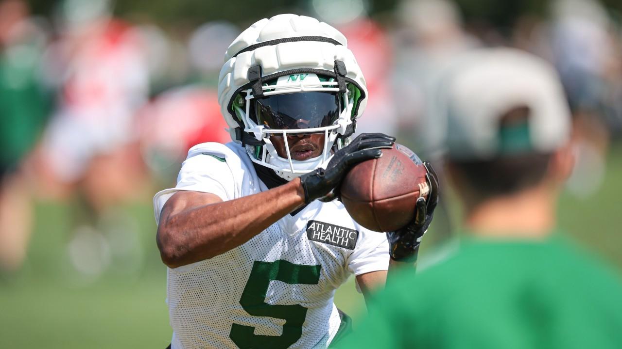 New York Jets wide receiver Garrett Wilson (5) catches the ball during a drill during training camp at Atlantic Health Jets Training Center.