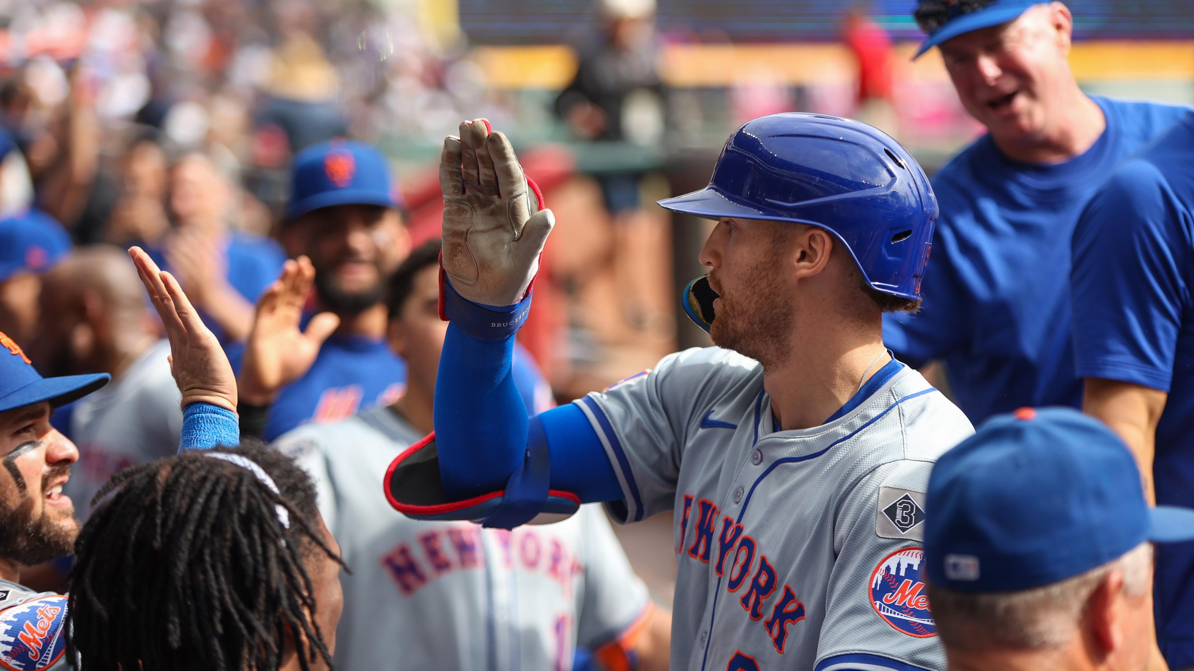 Sep 30, 2024; Atlanta, Georgia, USA; New York Mets left fielder Brandon Nimmo (9) celebrates with teammates after a two-run home run against the Atlanta Braves in the eighth inning at Truist Park. Mandatory Credit: Brett Davis-Imagn Images