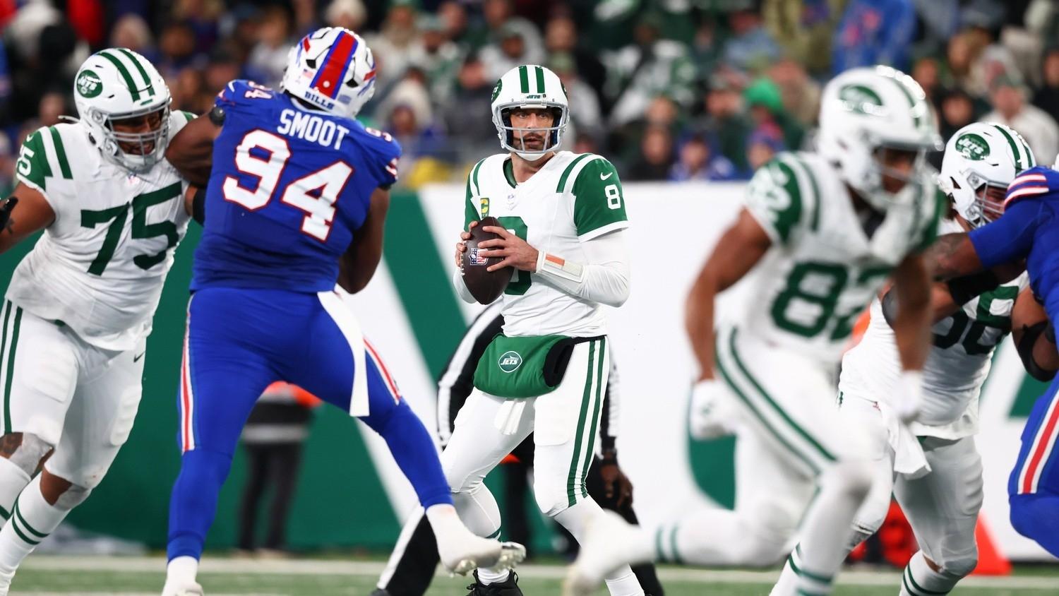 New York Jets quarterback Aaron Rodgers (8) looks to pass against the Buffalo Bills during the first half at MetLife Stadium.