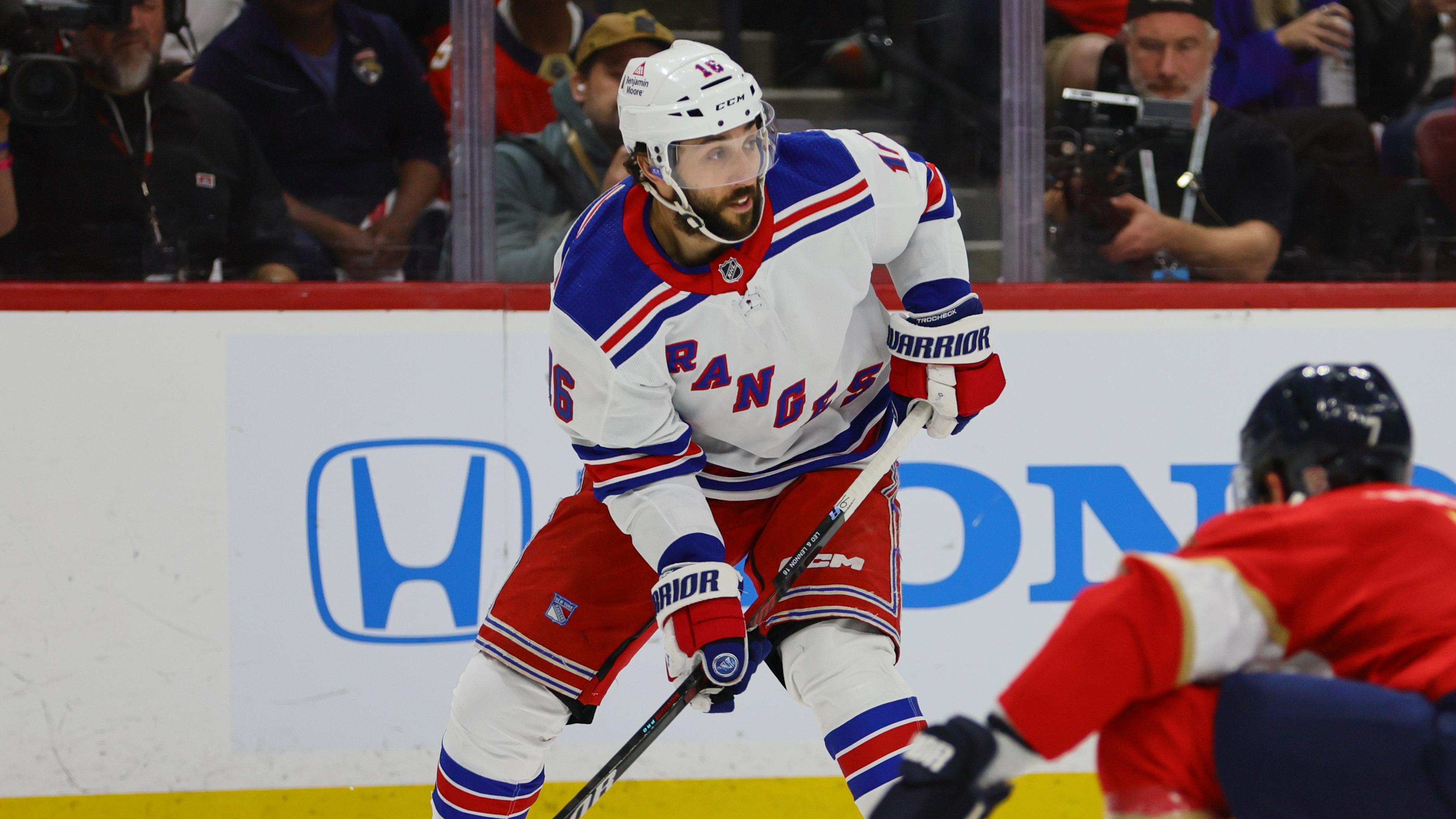 May 28, 2024; Sunrise, Florida, USA; New York Rangers center Vincent Trocheck (16) moves the puck against the Florida Panthers during the first period in game four of the Eastern Conference Final of the 2024 Stanley Cup Playoffs at Amerant Bank Arena. 