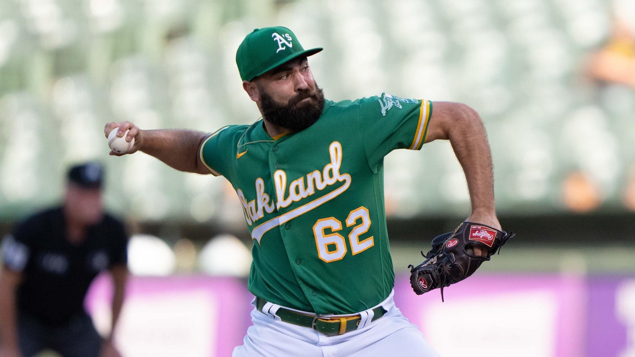 Oakland Athletics relief pitcher Lou Trivino (62) pitches during the ninth inning against the Detroit Tigers at RingCentral Coliseum.