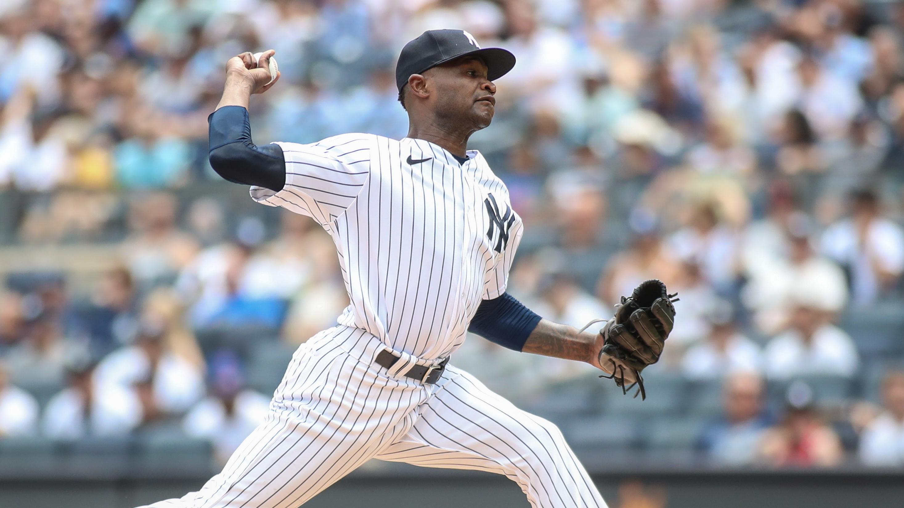 New York Yankees starting pitcher Domingo German (0) pitches in the first inning against the Chicago Cubs at Yankee Stadium