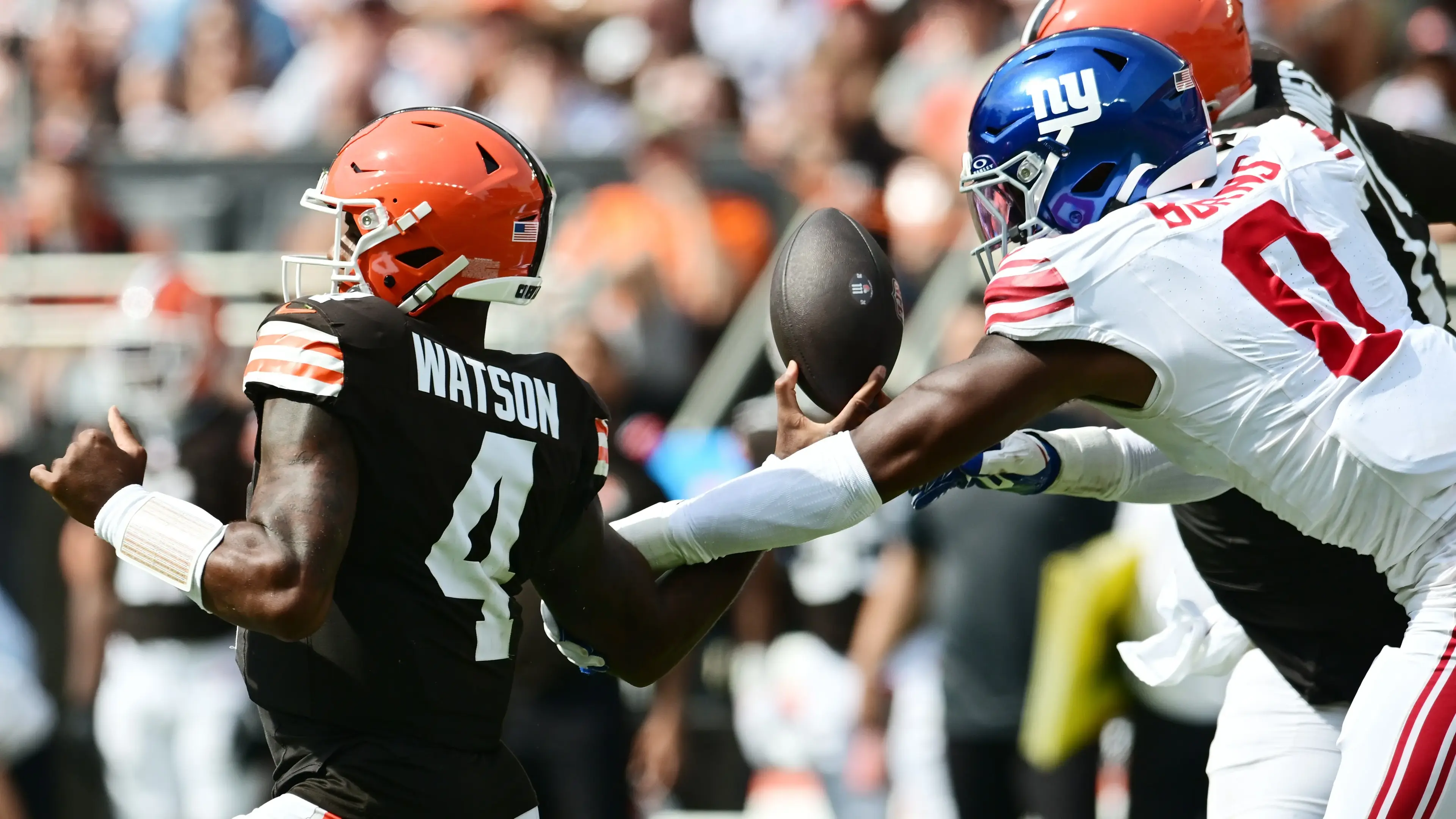 Sep 22, 2024; Cleveland, Ohio, USA; New York Giants linebacker Brian Burns (0) strip sacks Cleveland Browns quarterback Deshaun Watson (4) during the first half at Huntington Bank Field. Mandatory Credit: Ken Blaze-Imagn Images / © Ken Blaze-Imagn Images