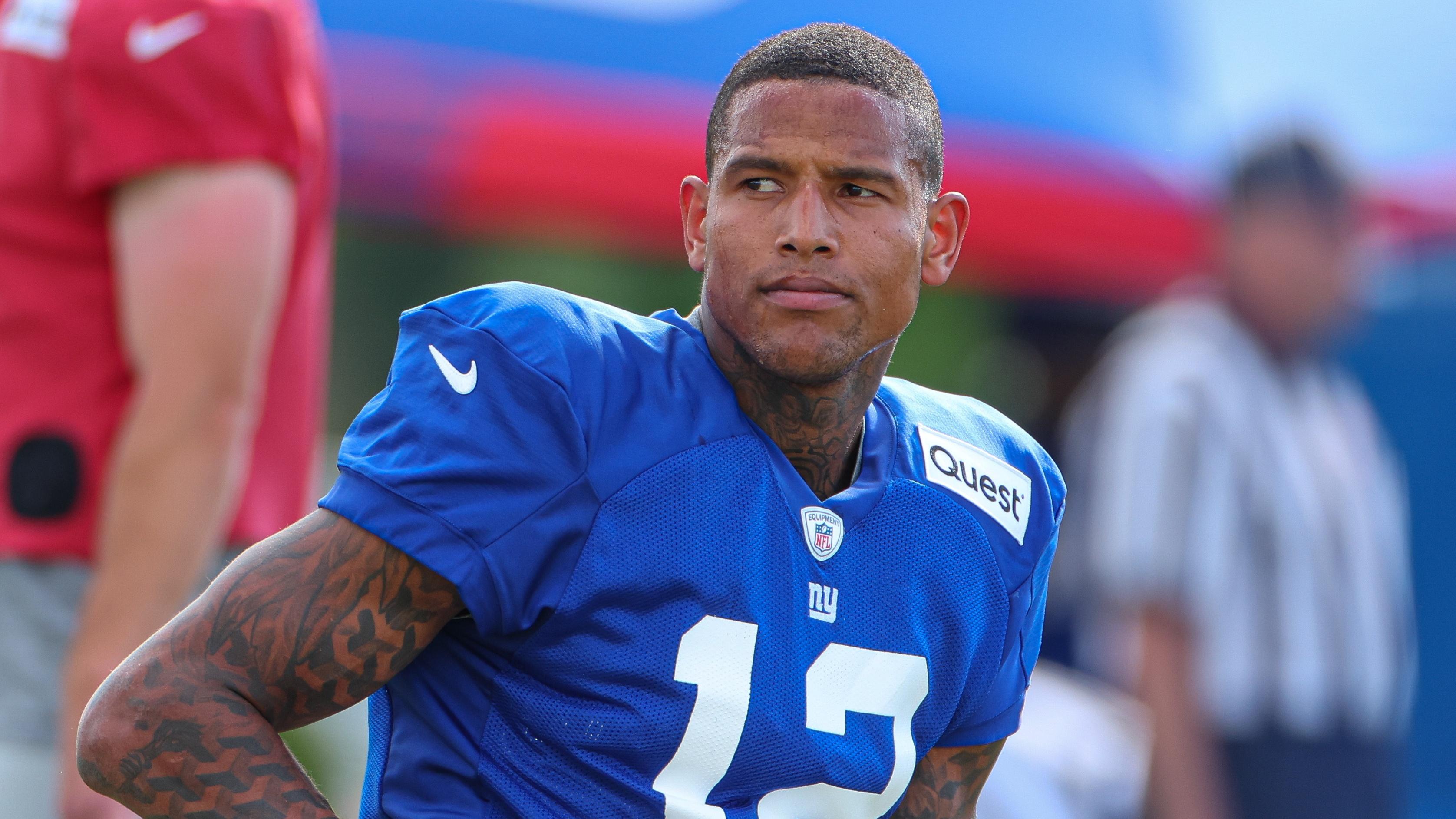 New York Giants tight end Darren Waller (12) stretches during training camp at the Quest Diagnostics Training Facility