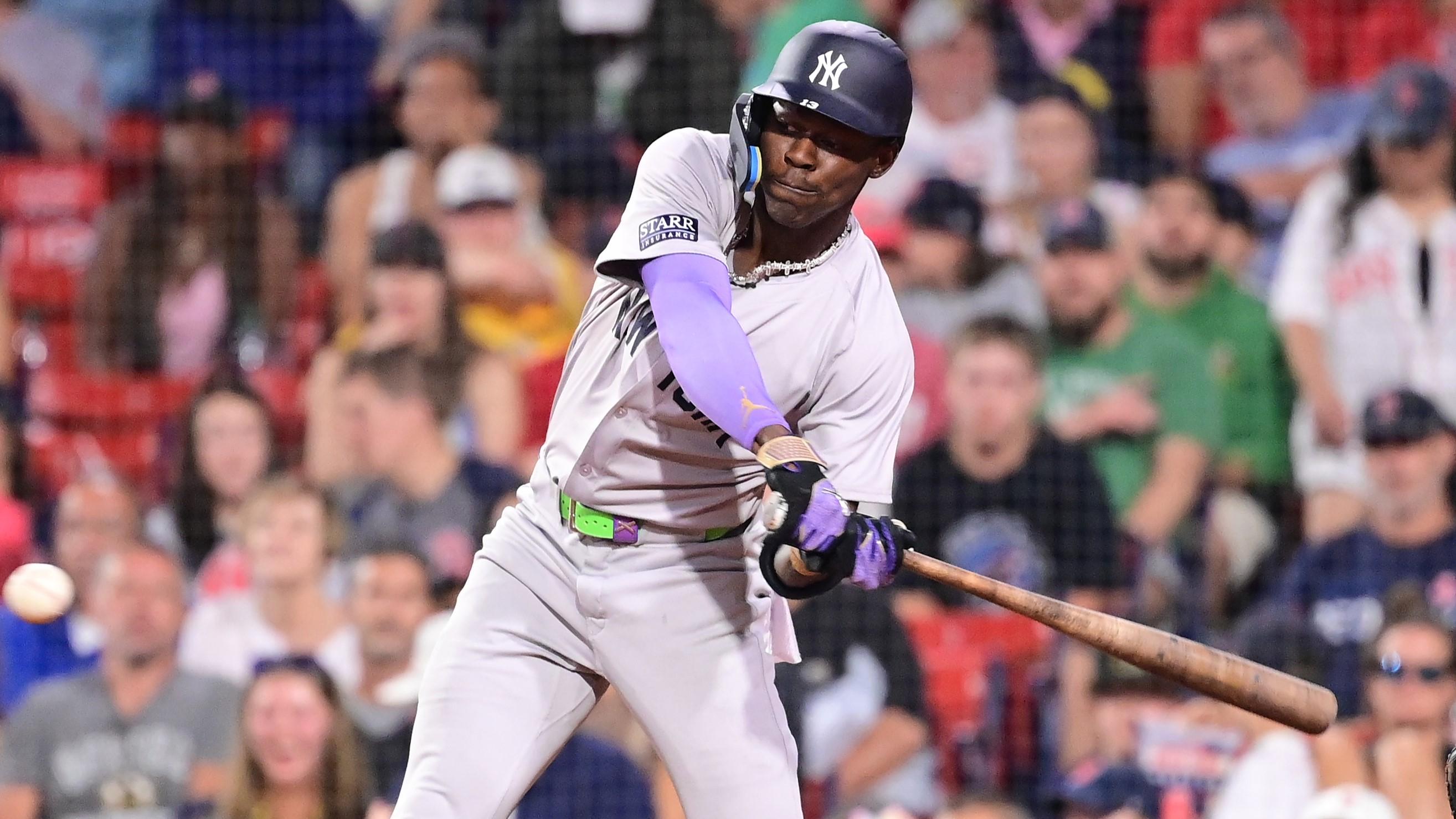 Jul 28, 2024; Boston, Massachusetts, USA; New York Yankees center fielder Jazz Chisholm Jr (13) hits a single against the Boston Red Sox during the ninth inning at Fenway Park. Mandatory Credit: Eric Canha-USA TODAY Sports