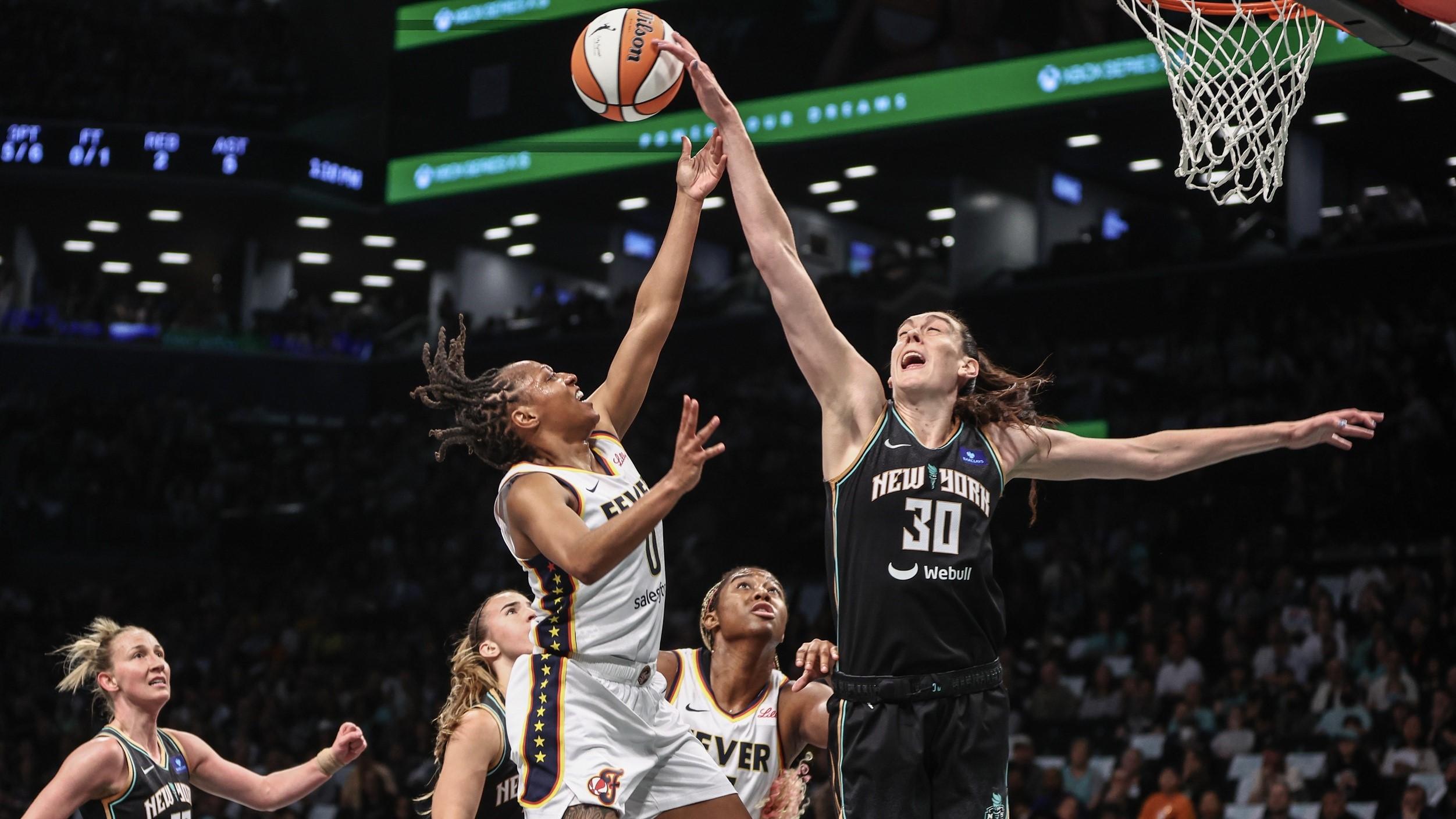 May 18, 2024; Brooklyn, New York, USA; New York Liberty forward Breanna Stewart (30) blocks a shot taken by Indiana Fever guard Kelsey Mitchell (0) in the first quarter at Barclays Center.