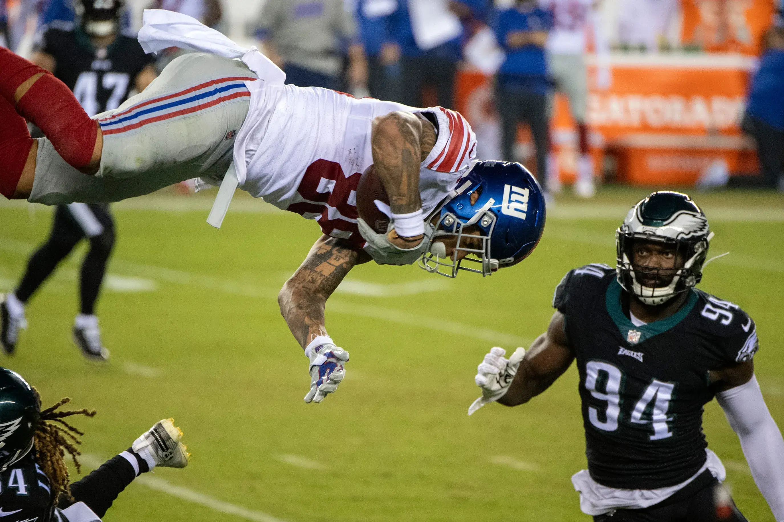 Giants' Evan Engram (88) flips over Eagles' Cre'Von LeBlanc (34) in Philadelphia, Pa. on Thursday, Oct. 22, 2020. Jl Eagles Giants 102220 09 / © JOE LAMBERTI/COURIER POST via Imagn Content Services, LLC