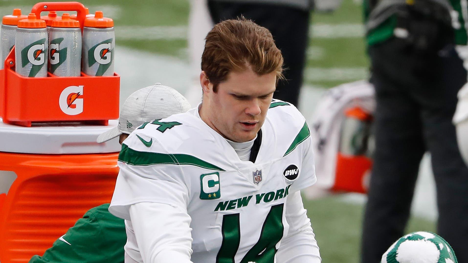 Jan 3, 2021; Foxborough, Massachusetts, USA; New York Jets quarterback Sam Darnold (14) on the bench against the New England Patriots during the first half at Gillette Stadium. / Winslow Townson-USA TODAY Sports