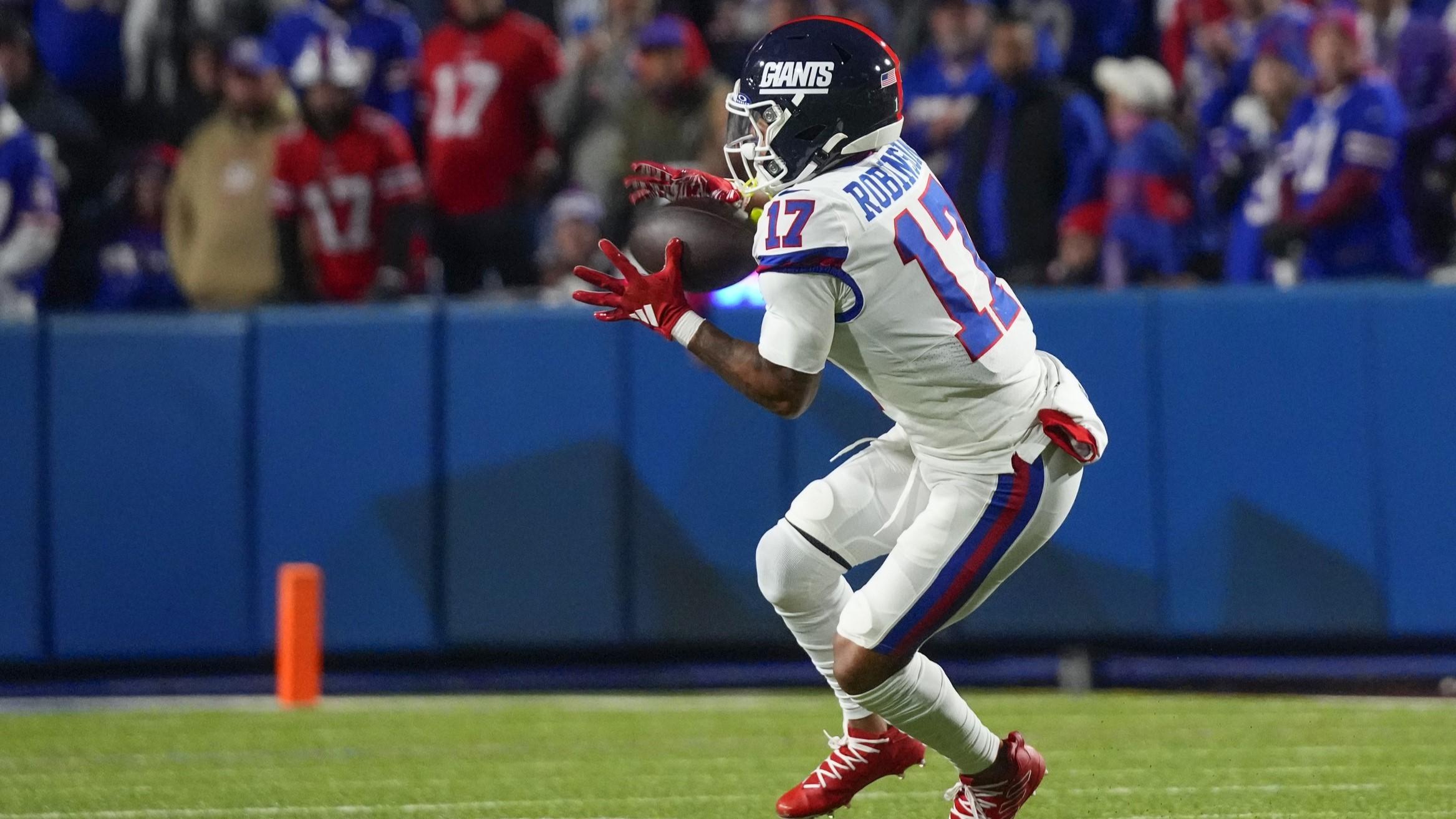 Oct 15, 2023; Orchard Park, New York, USA; New York Giants wide receiver Wan'Dale Robinson (17) makes a catch against the Buffalo Bills during the second half at Highmark Stadium.