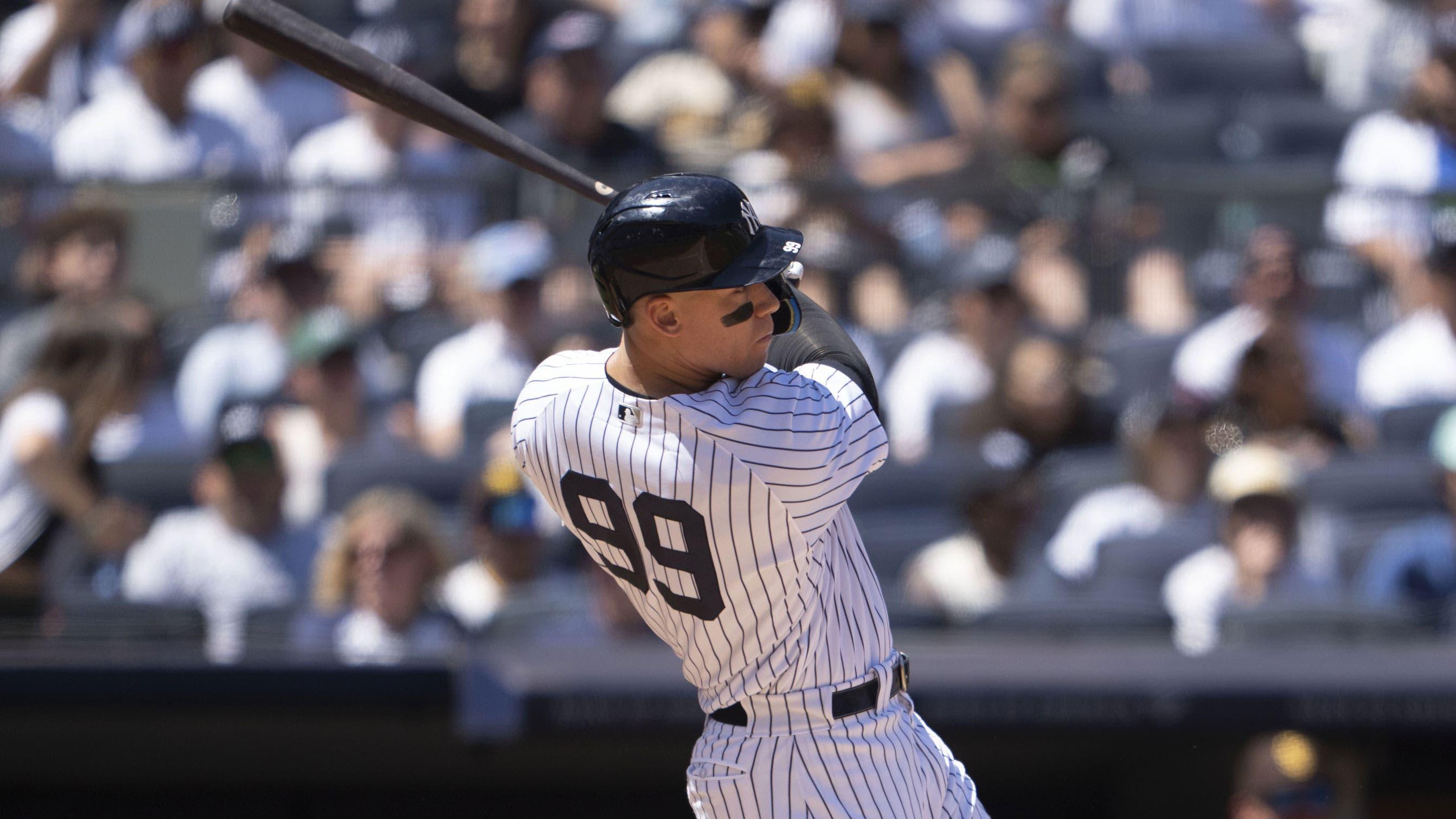 May 28, 2023; Bronx, New York, USA; New York Yankees right fielder Aaron Judge (99) hits an RBI single against the San Diego Padres during the third inning at Yankee Stadium. / Gregory Fisher-USA TODAY Sports