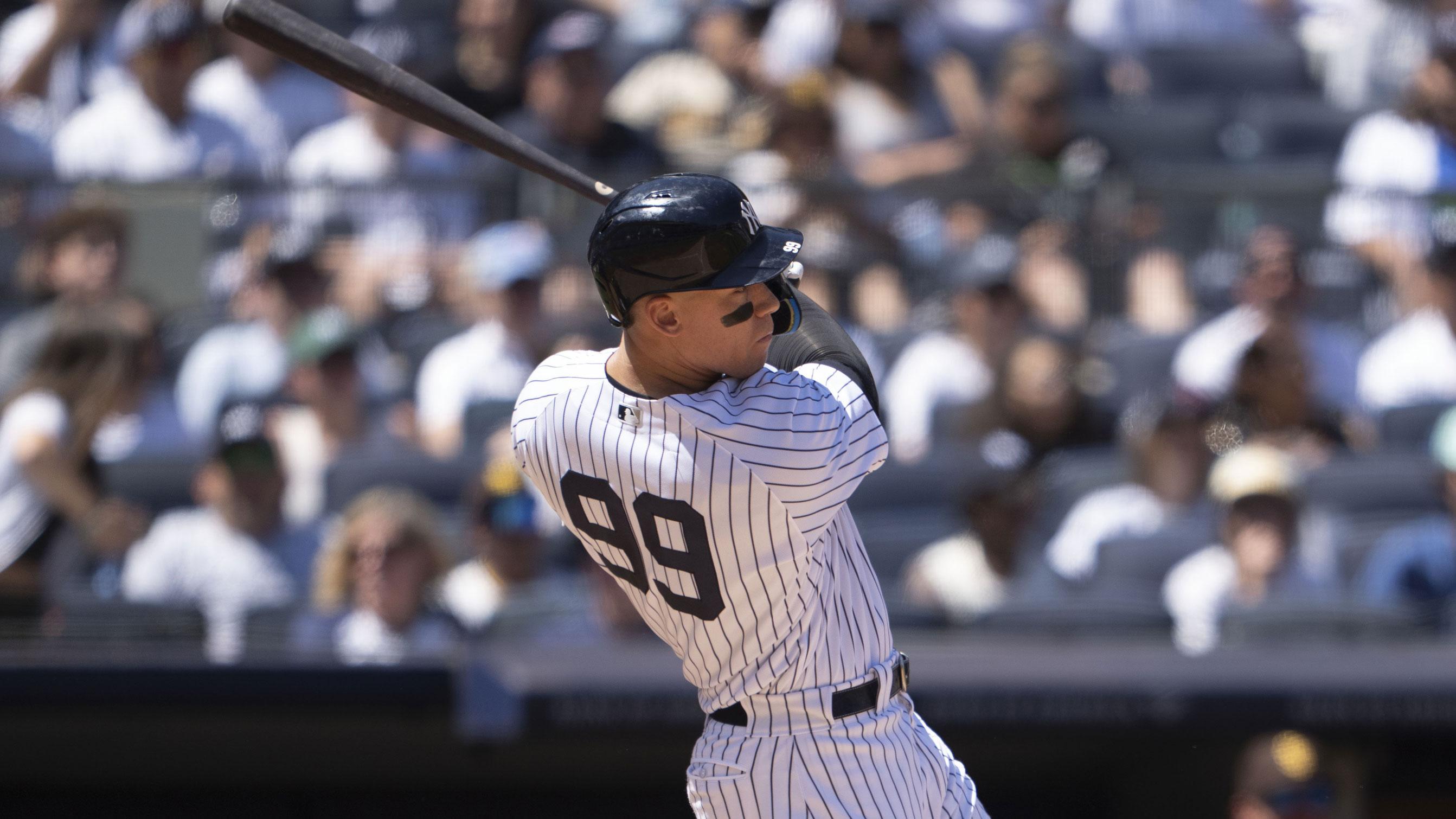 May 28, 2023; Bronx, New York, USA; New York Yankees right fielder Aaron Judge (99) hits an RBI single against the San Diego Padres during the third inning at Yankee Stadium.