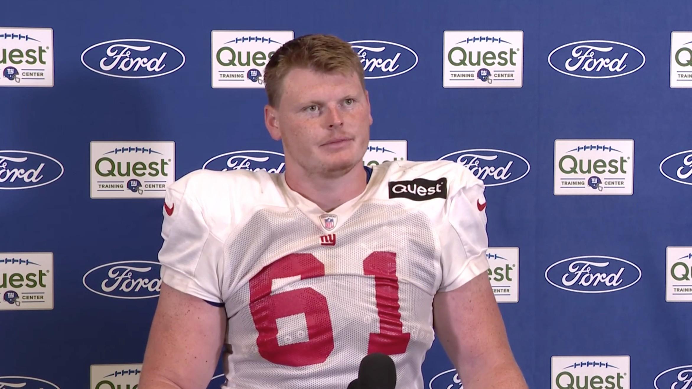 New York Giants rookie center John Michael Schmitz speaks to the media after practice at training camp.