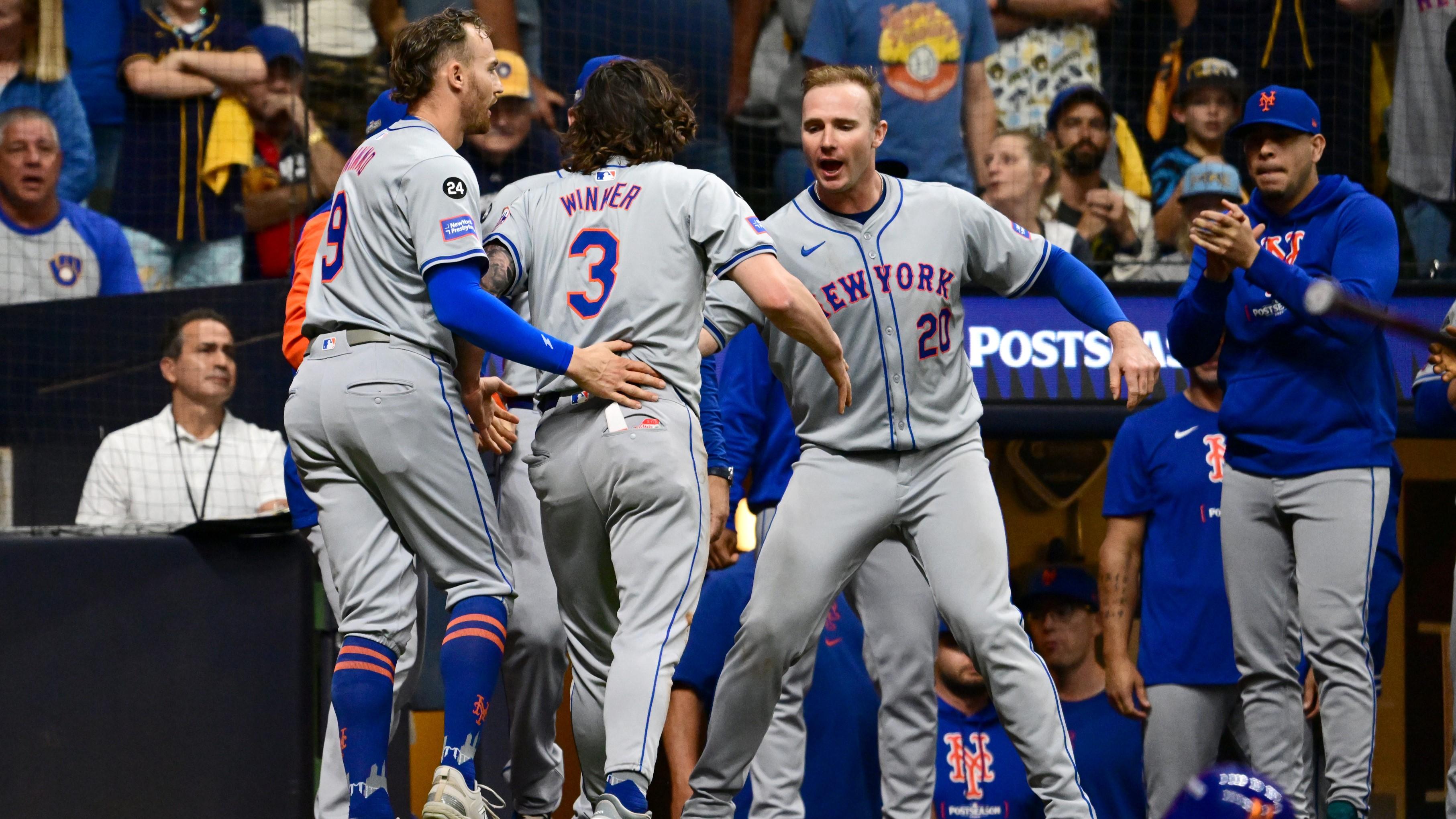 Oct 3, 2024; Milwaukee, Wisconsin, USA; New York Mets outfielder Jesse Winker (3) celebrates with first baseman Pete Alonso (20) and outfielder Brandon Nimmo (9) after scoring against the Milwaukee Brewers in the ninth inning during game three of the Wildcard round for the 2024 MLB Playoffs at American Family Field. Mandatory Credit: Benny Sieu-Imagn Images