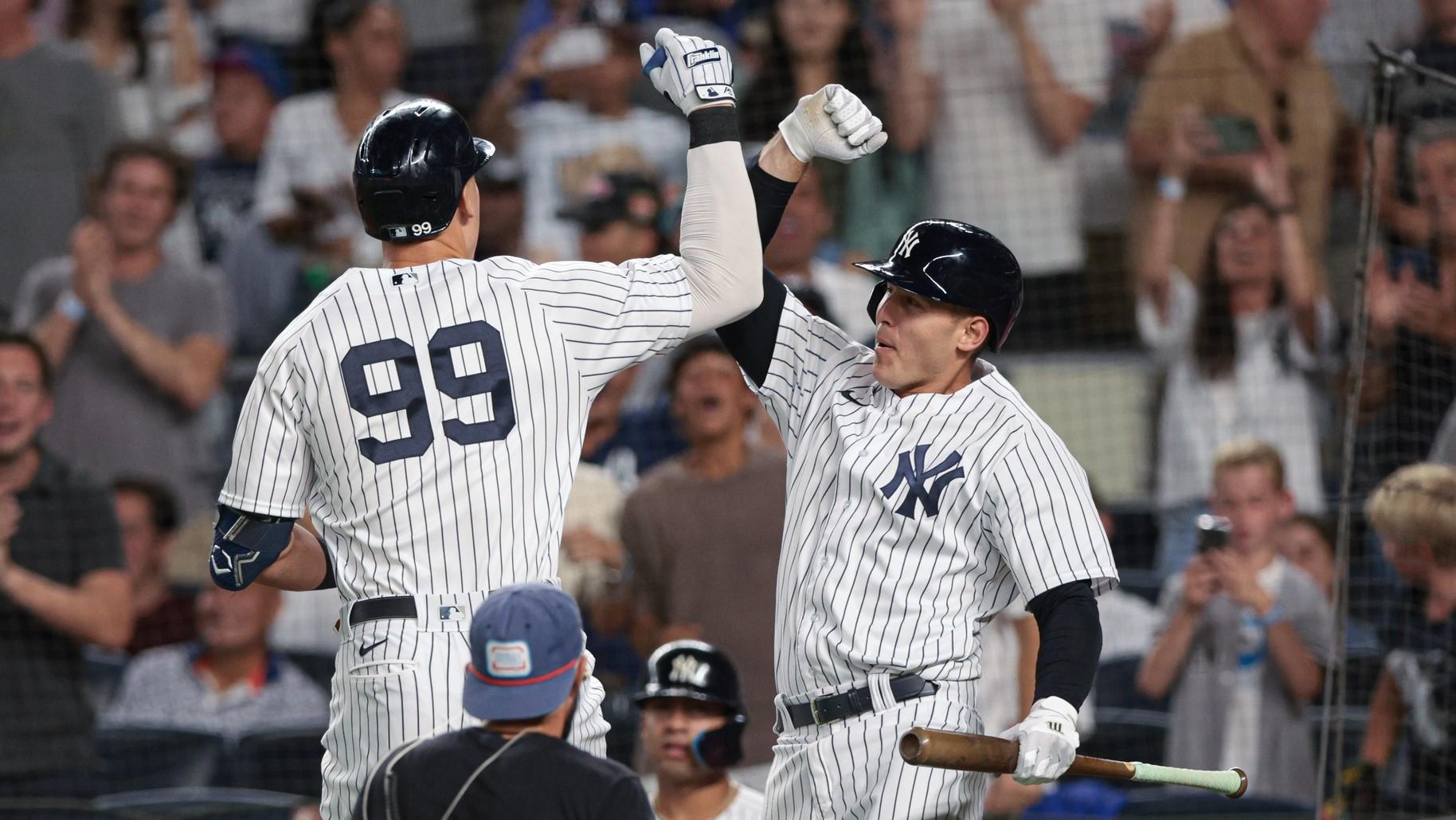 Aug 23, 2022; Bronx, New York, USA; New York Yankees right fielder Aaron Judge (99) celebrates after hitting a solo home run with first baseman Anthony Rizzo (48) during the fourth inning against the New York Mets at Yankee Stadium.