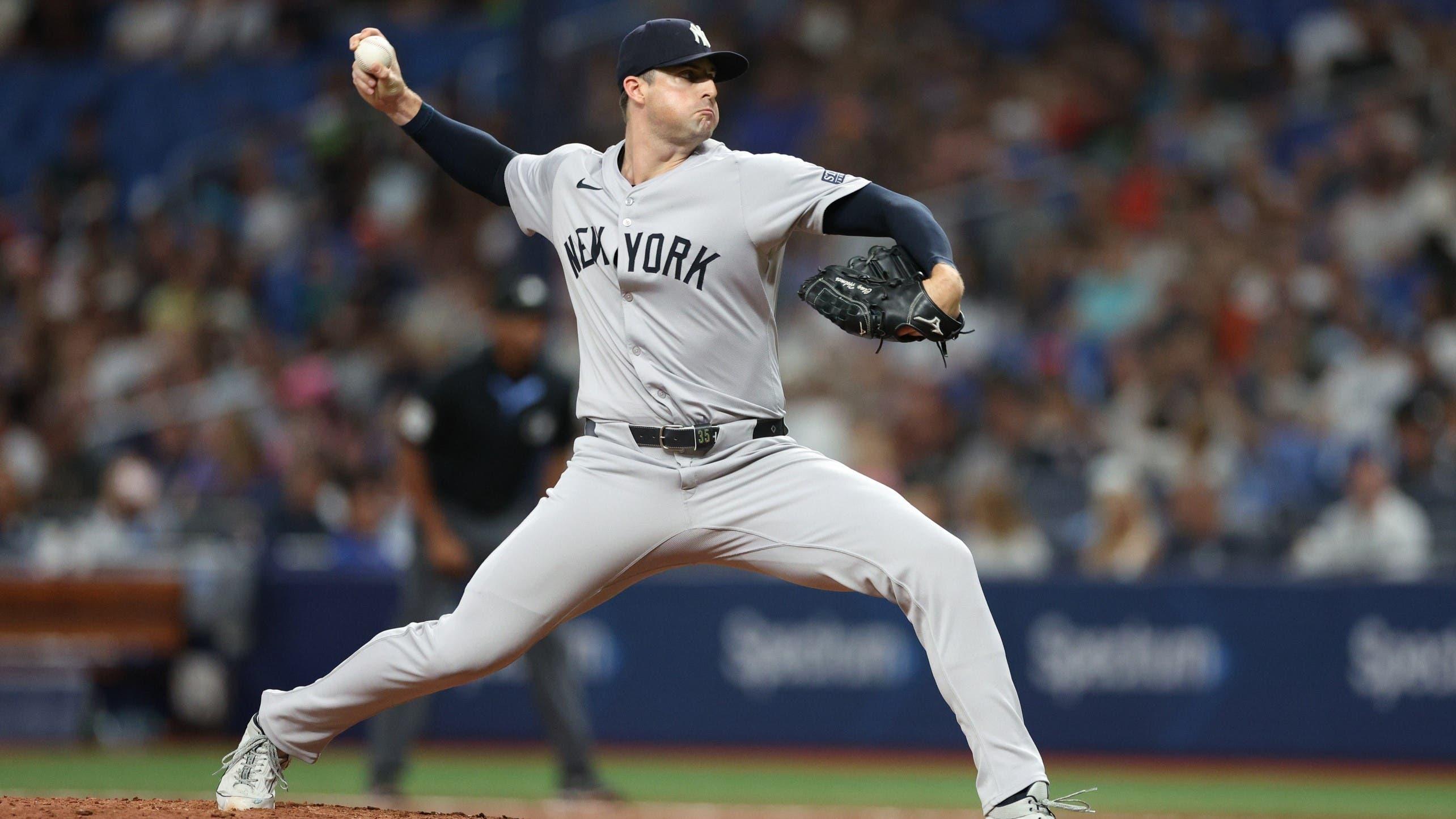 Jul 10, 2024; St. Petersburg, Florida, USA; New York Yankees pitcher Clay Holmes (35) throws a pitch against the Tampa Bay Rays in the eighth inning at Tropicana Field. / Nathan Ray Seebeck-Imagn Images