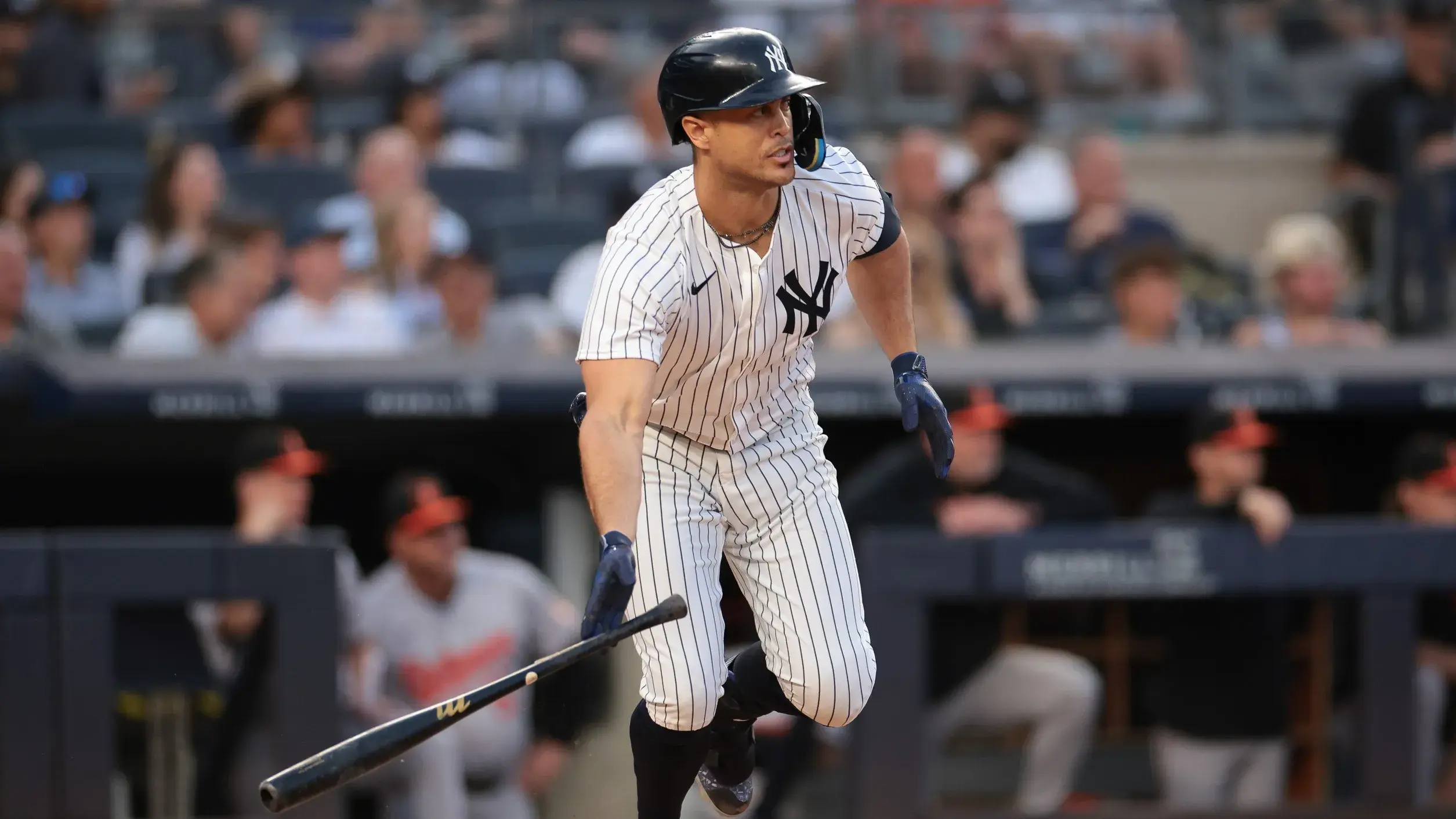 Jun 18, 2024; Bronx, New York, USA; New York Yankees designated hitter Giancarlo Stanton (27) hits an RBI single during the third inning against the Baltimore Orioles at Yankee Stadium. / Vincent Carchietta-USA TODAY Sports