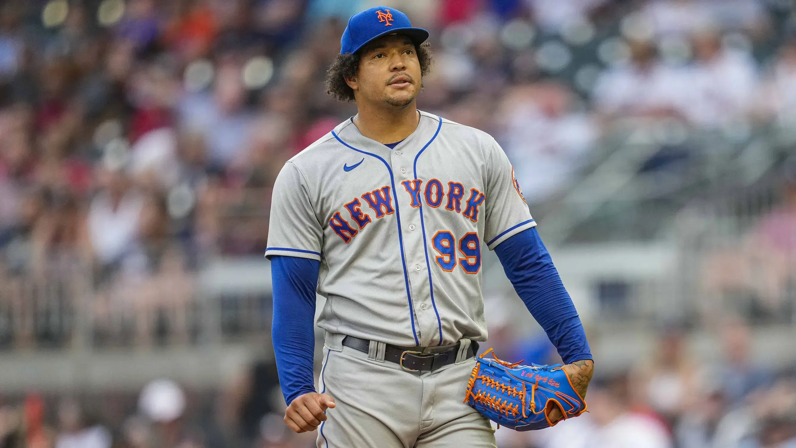 Aug 16, 2022; Cumberland, Georgia, USA; New York Mets starting pitcher Taijuan Walker (99) reacts after issuing a walk against the Atlanta Braves during the first inning at Truist Park. / Dale Zanine-USA TODAY Sports