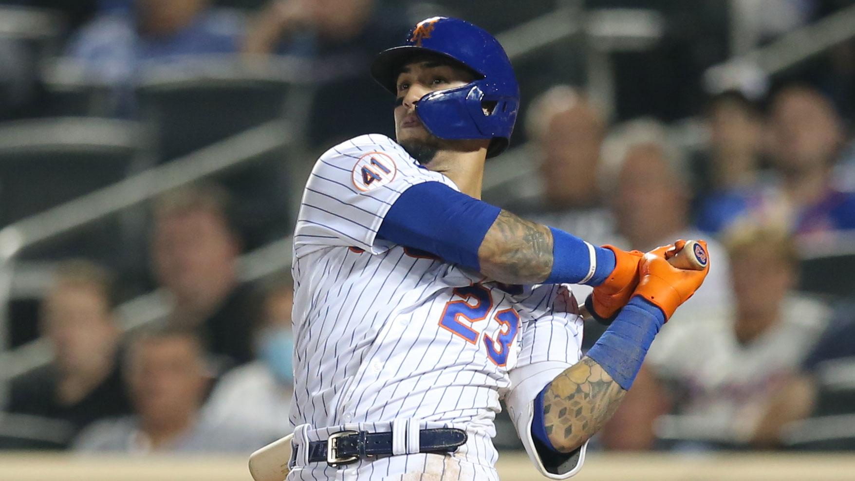 Sep 14, 2021; New York City, New York, USA; New York Mets second baseman Javier Baez (23) follows through on a game tying solo home run against the St. Louis Cardinals during the ninth inning at Citi Field.