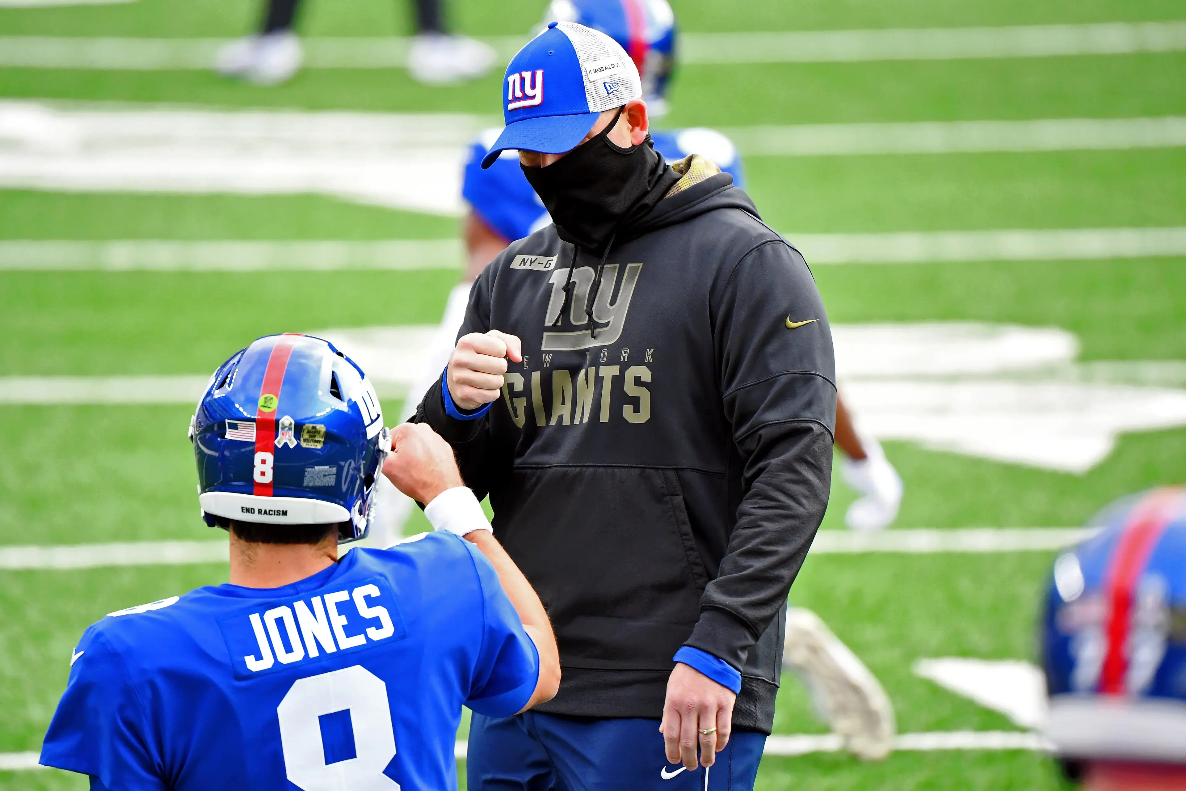 Nov 15, 2020; East Rutherford, New Jersey, USA; New York Giants head coach Joe Judge fist bumps quarterback Daniel Jones (8) before their game against the Philadelphia Eagles at MetLife Stadium. Mandatory Credit: Robert Deutsch-USA TODAY Sports / © Robert Deutsch-USA TODAY Sports