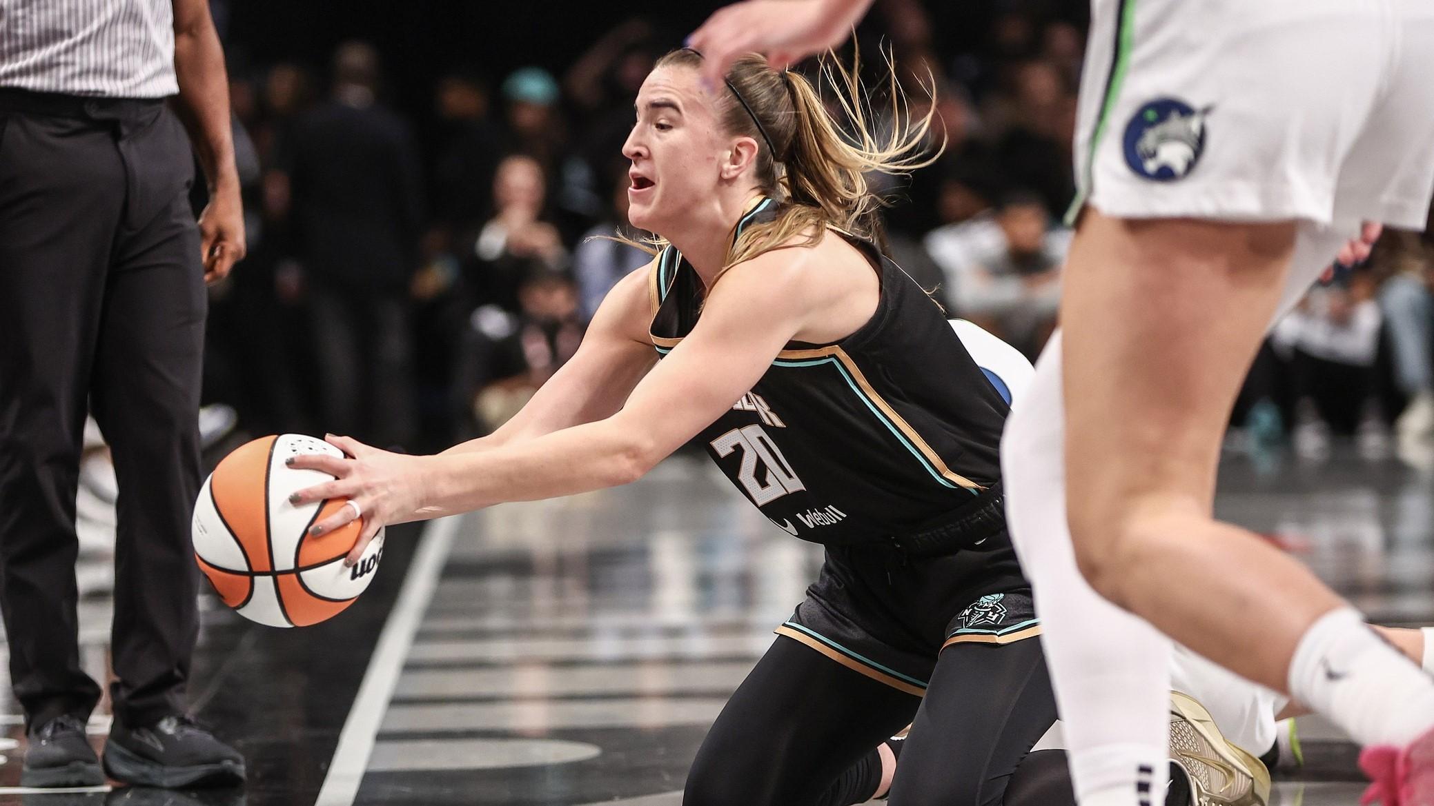 Oct 10, 2024; Brooklyn, New York, USA; New York Liberty guard Sabrina Ionescu (20) saves the ball from going out of bounds in the first quarter against the Minnesota Lynx at Barclays Center.