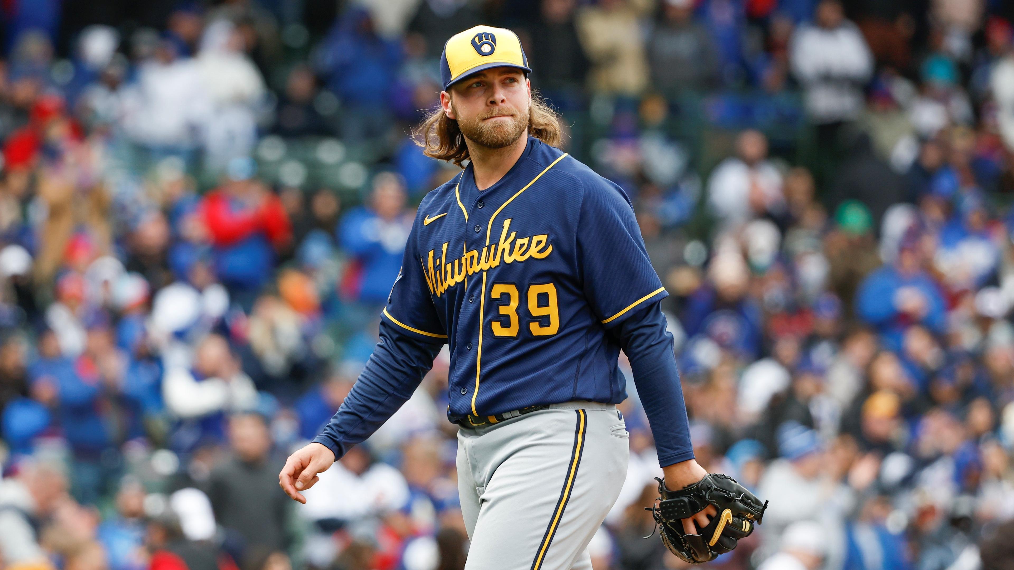 Mar 30, 2023; Chicago, Illinois, USA; Milwaukee Brewers starting pitcher Corbin Burnes (39) walks back to dugout after delivering against the Chicago Cubs during the third inning at Wrigley Field. Mandatory Credit: Kamil Krzaczynski-USA TODAY Sports