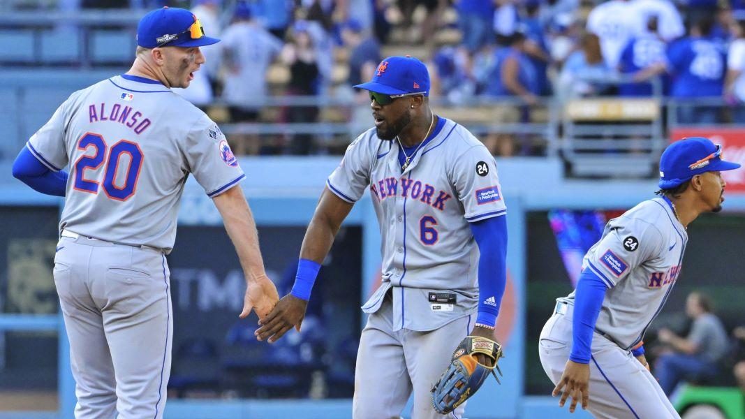 Oct 14, 2024; Los Angeles, California, USA; New York Mets first baseman Pete Alonso (20) and outfielder Starling Marte (6) celebrate after defeating the Los Angeles Dodgers in game two of the NLCS for the 2024 MLB Playoffs at Dodger Stadium.