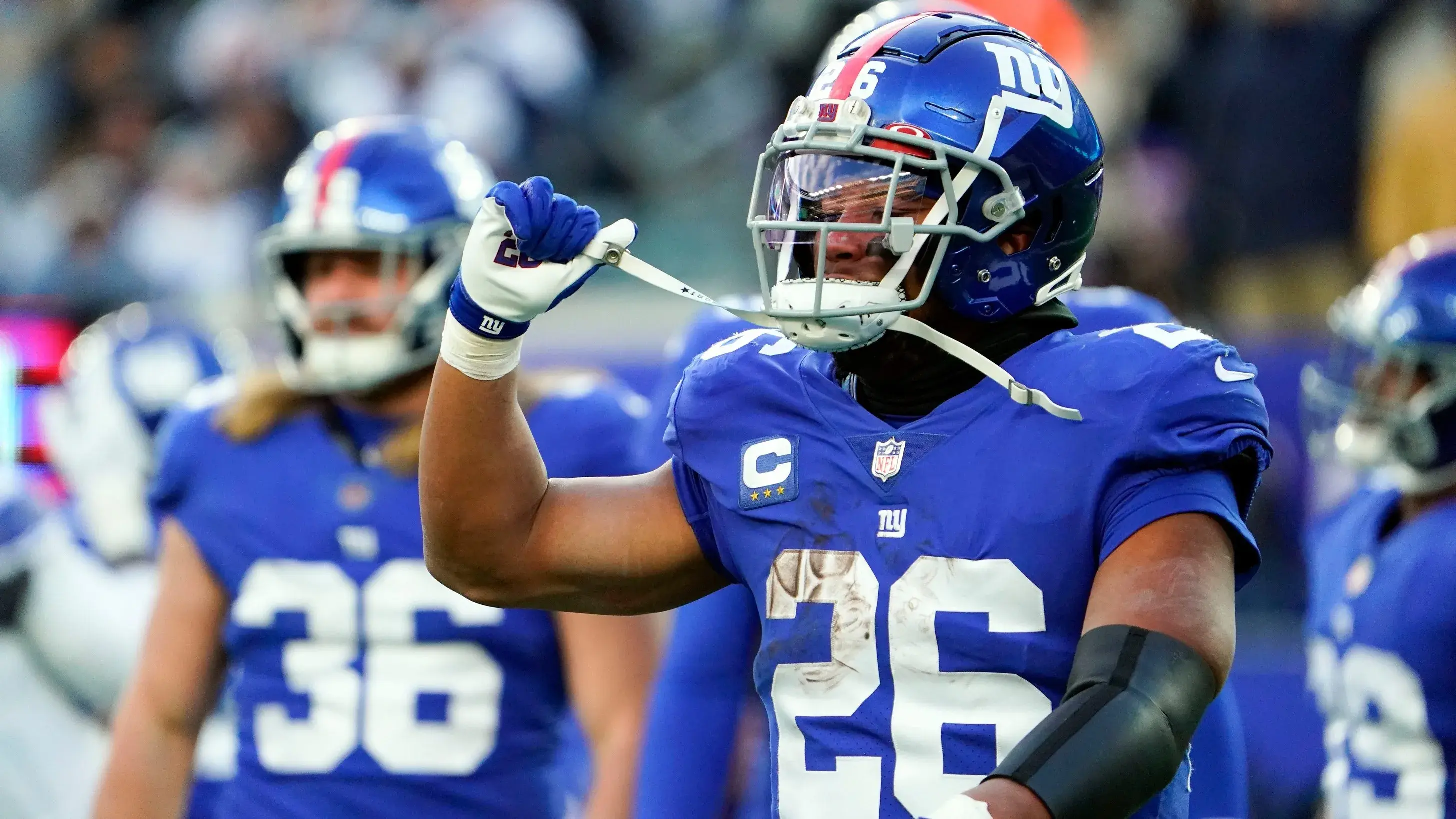 New York Giants running back Saquon Barkley (26) reacts as the offense leaves the field in the second half at MetLife Stadium. The Giants fall to the Cowboys, 21-6, on Sunday, Dec. 19, 2021, in East Rutherford. Nyg Vs Dal / © Danielle Parhizkaran/NorthJersey.com / USA TODAY NETWORK