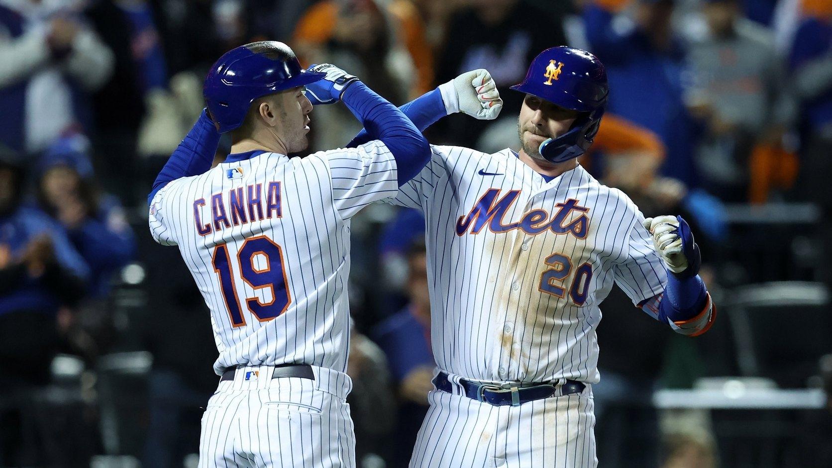 New York Mets first baseman Pete Alonso (20) reacts with left fielder Mark Canha (19) after hitting a solo home run against the San Diego Padres in the fifth inning during game two of the Wild Card series.