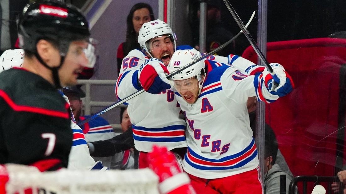 New York Rangers left wing Artemi Panarin (10) celebrates his game winning goal with center Vincent Trocheck (16) against the Carolina Hurricanes in the first overtime against the Carolina Hurricanes in game three of the second round of the 2024 Stanley Cup Playoffs at PNC Arena.