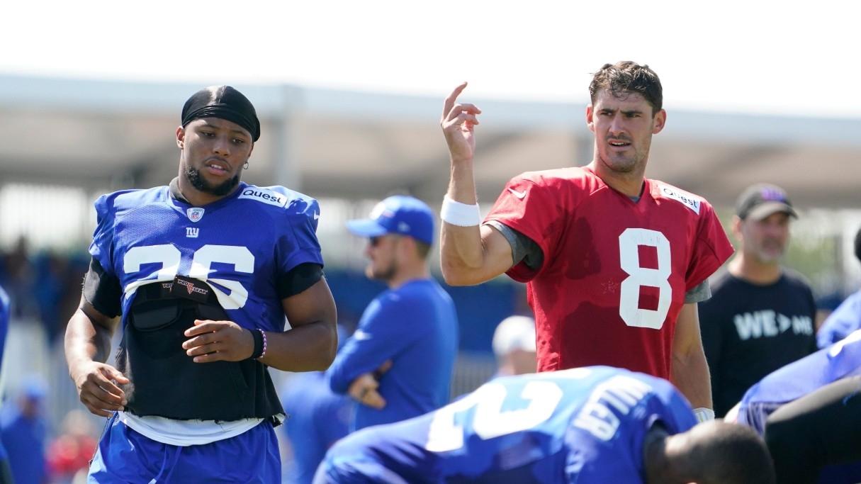 New York Giants quarterback Daniel Jones (8) and running back Saquon Barkley (26) line up during training camp.