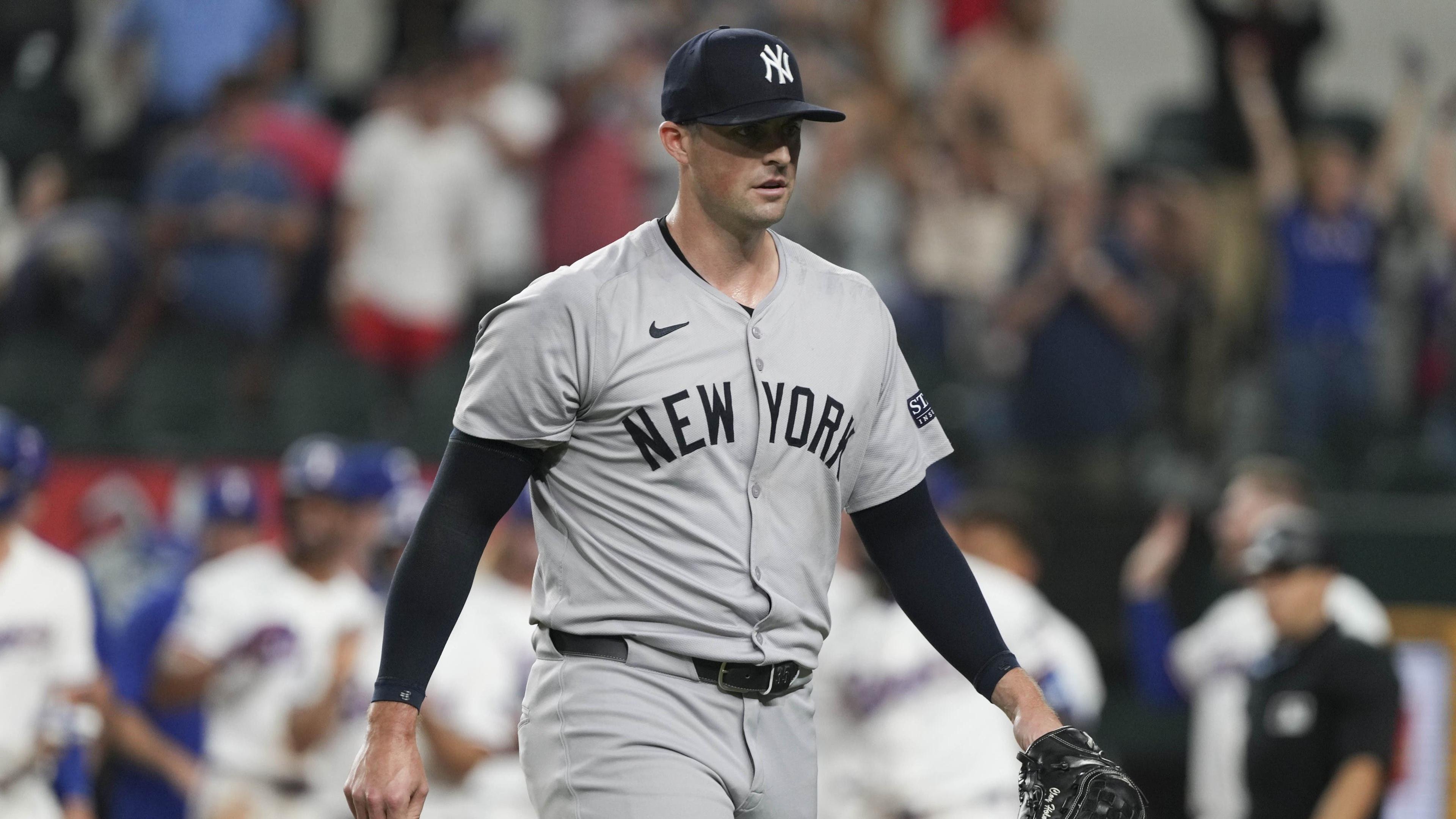 Sep 3, 2024; Arlington, Texas, USA; New York Yankees relief pitcher Clay Holmes (35) walks from the field after giving up a grand slam walk-off to Texas Rangers center fielder Wyatt Langford (not shown) during the ninth inning at Globe Life Field. / Jim Cowsert-Imagn Images