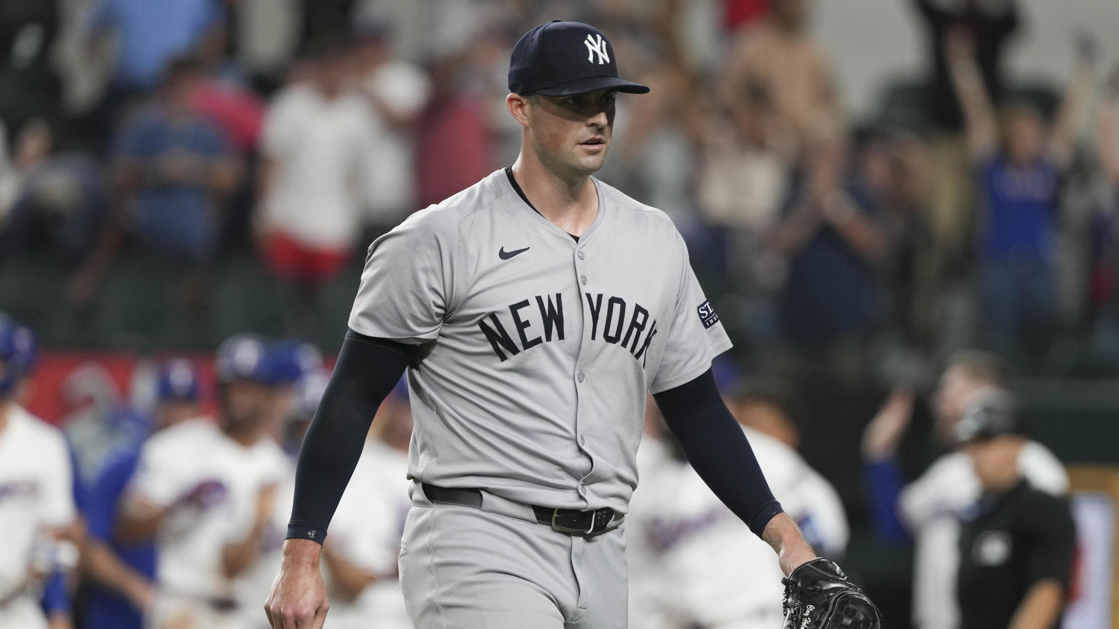 Sep 3, 2024; Arlington, Texas, USA; New York Yankees relief pitcher Clay Holmes (35) walks from the field after giving up a grand slam walk-off to Texas Rangers center fielder Wyatt Langford (not shown) during the ninth inning at Globe Life Field. 