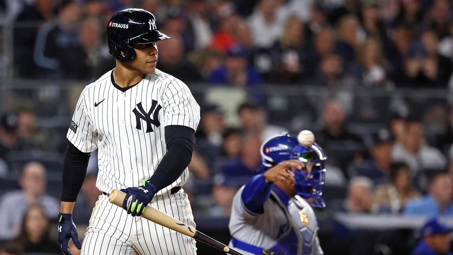 New York Yankees outfielder Juan Soto (22) reacts after striking out against the Kansas City Royals in the third inning during game two of the ALDS for the 2024 MLB Playoffs at Yankee Stadium.