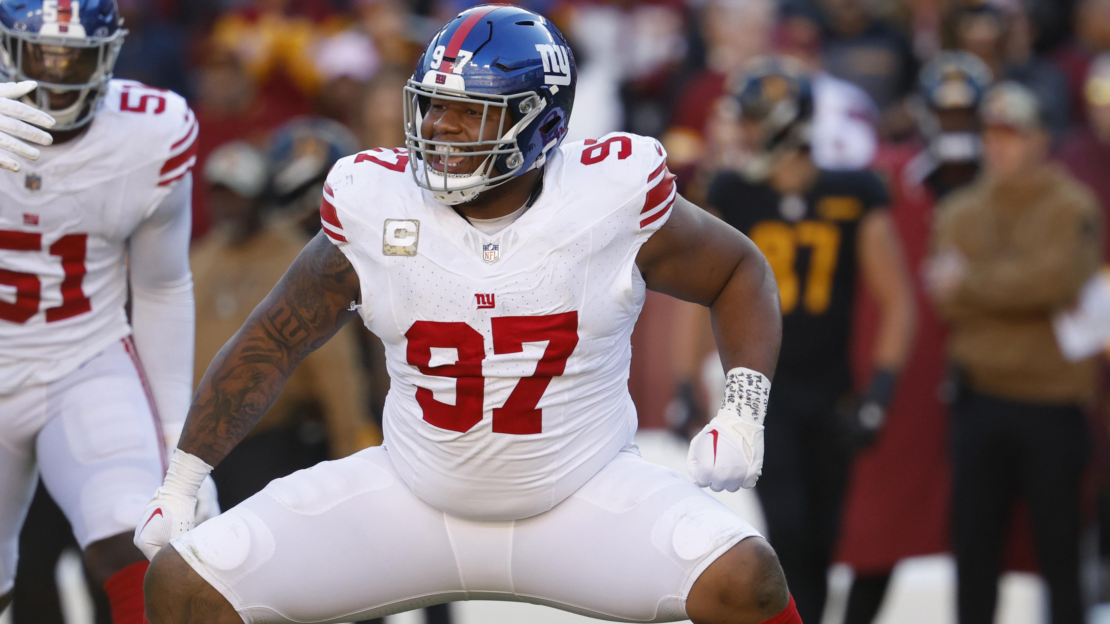 New York Giants defensive tackle Dexter Lawrence II (97) celebrates after a sack against the Washington Commanders during the second quarter at FedExField