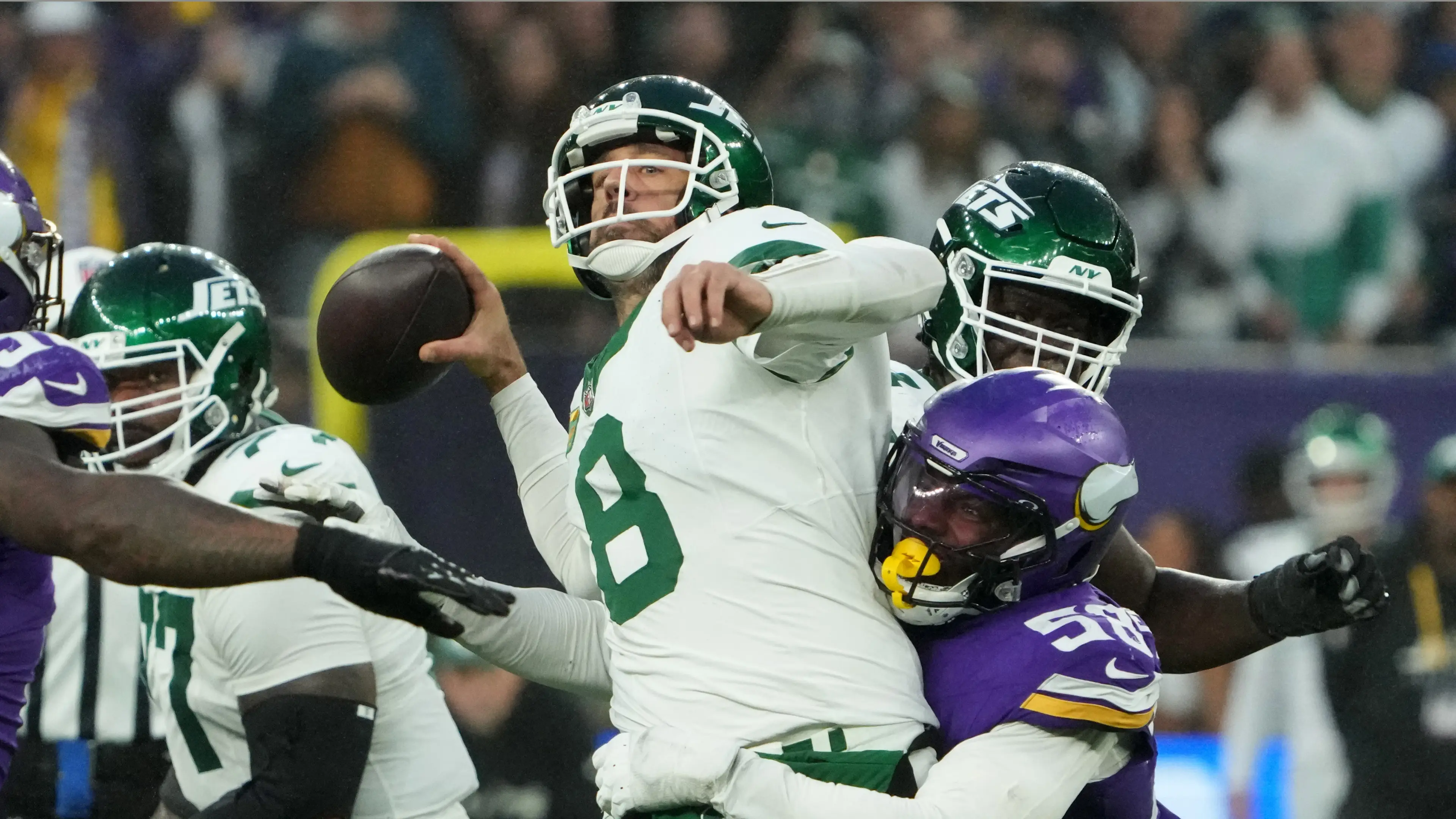 Oct 6, 2024; London, United Kingdom; New York Jets quarterback Aaron Rodgers (8) throws the ball under pressure from Minnesota Vikings linebacker Jonathan Greenard (58) in the fourth quarter at Tottenham Hotspur Stadium. Mandatory Credit: Kirby Lee-Imagn Images / © Kirby Lee-Imagn Images