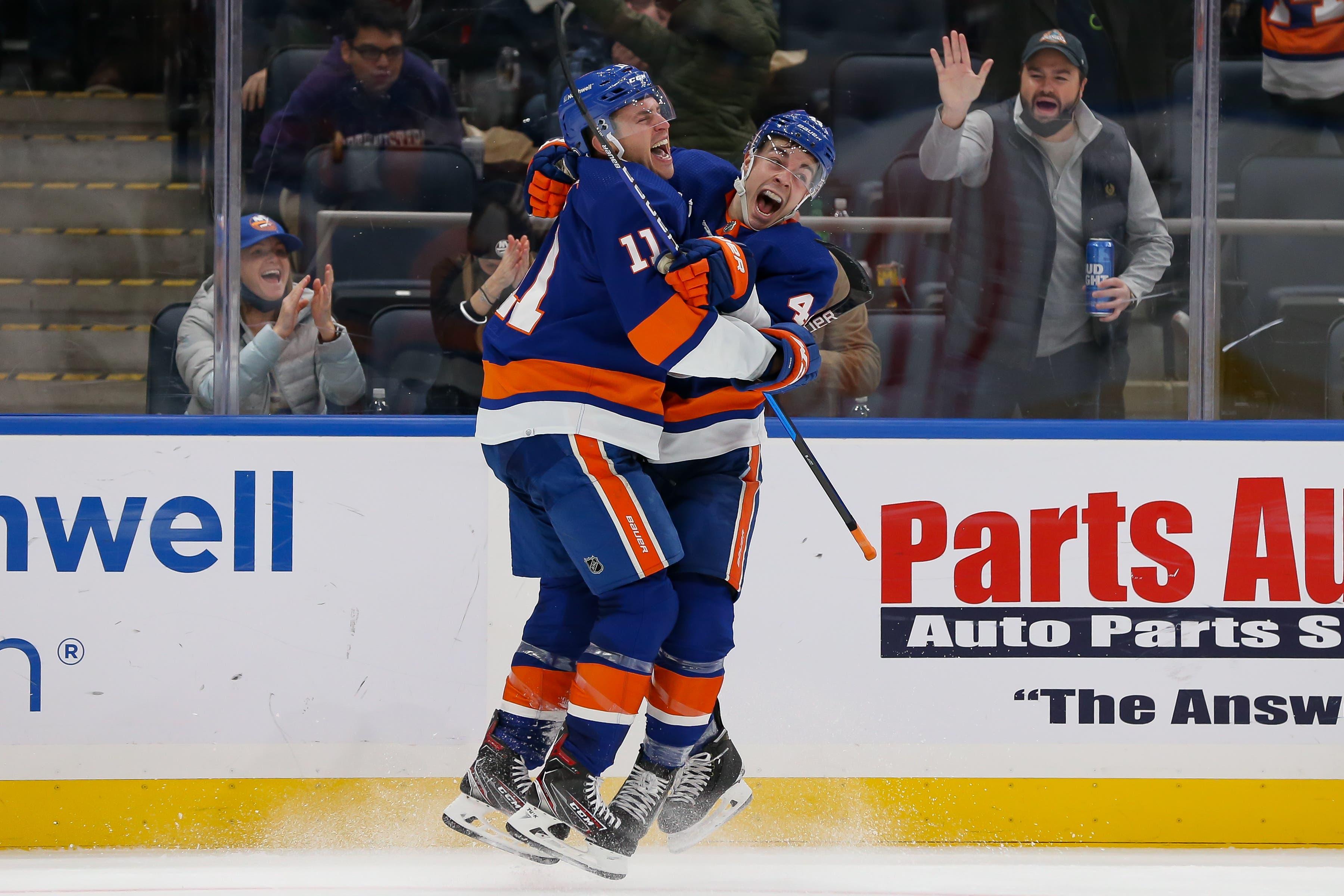 New York Islanders left wing Zach Parise (11) celebrates with New York Islanders center Jean-Gabriel Pageau (44) after scoring a short handed goal against New Jersey Devils during the second period at UBS Arena. / Tom Horak-USA TODAY Sports