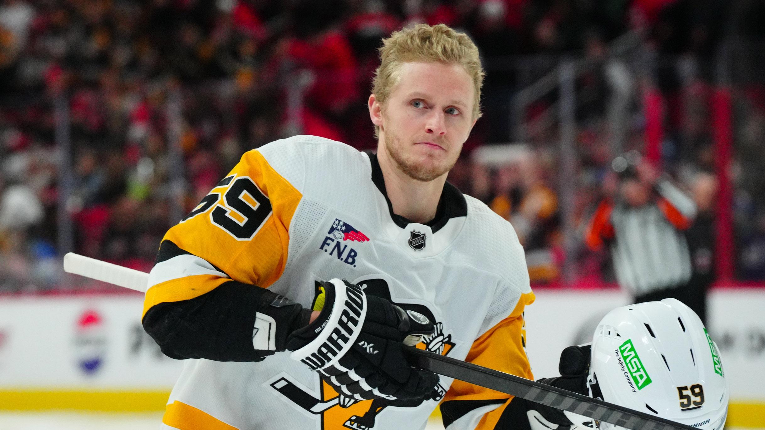 Jan 13, 2024; Raleigh, North Carolina, USA; Pittsburgh Penguins left wing Jake Guentzel (59) looks on at the start of the game against the Carolina Hurricanes at PNC Arena.