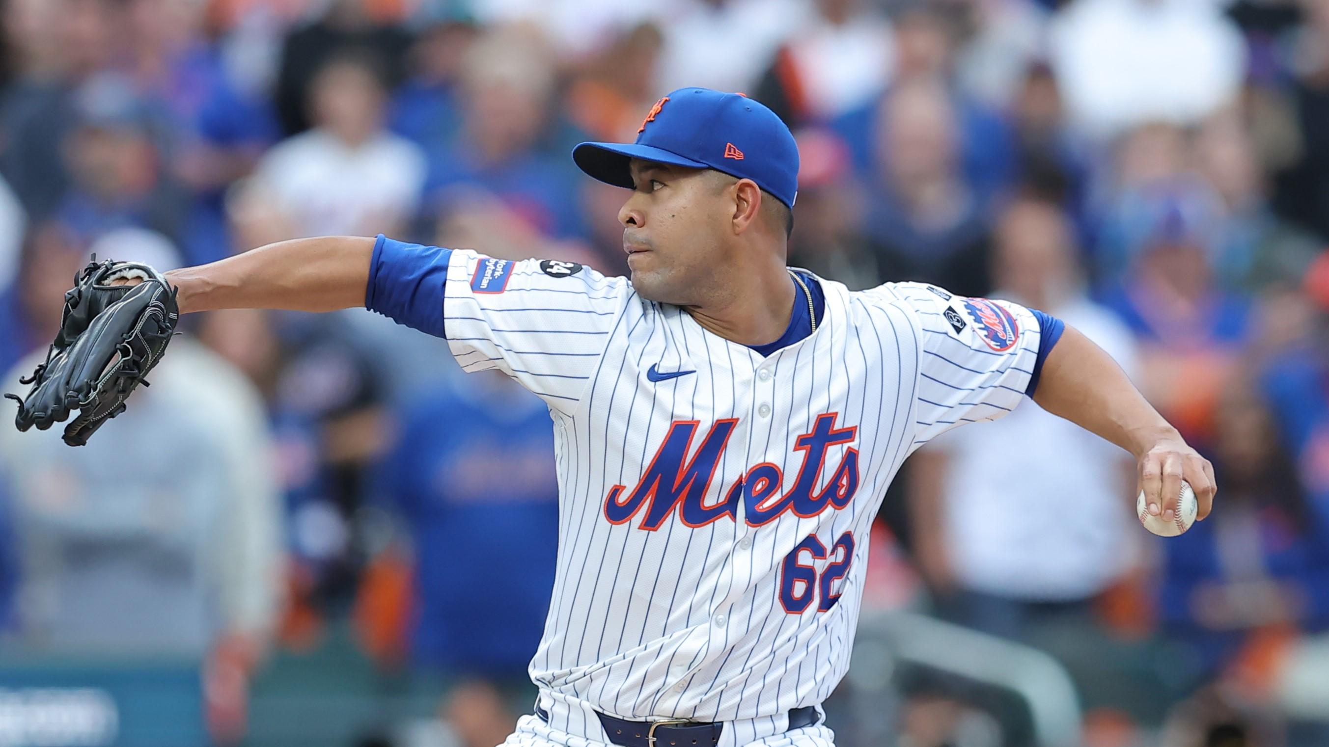 Oct 9, 2024; New York, New York, USA; New York Mets pitcher Jose Quintana (62) throws a pitch against the Philadelphia Phillies in the first inning in game four of the NLDS for the 2024 MLB Playoffs at Citi Field. Mandatory Credit: Brad Penner-Imagn Images