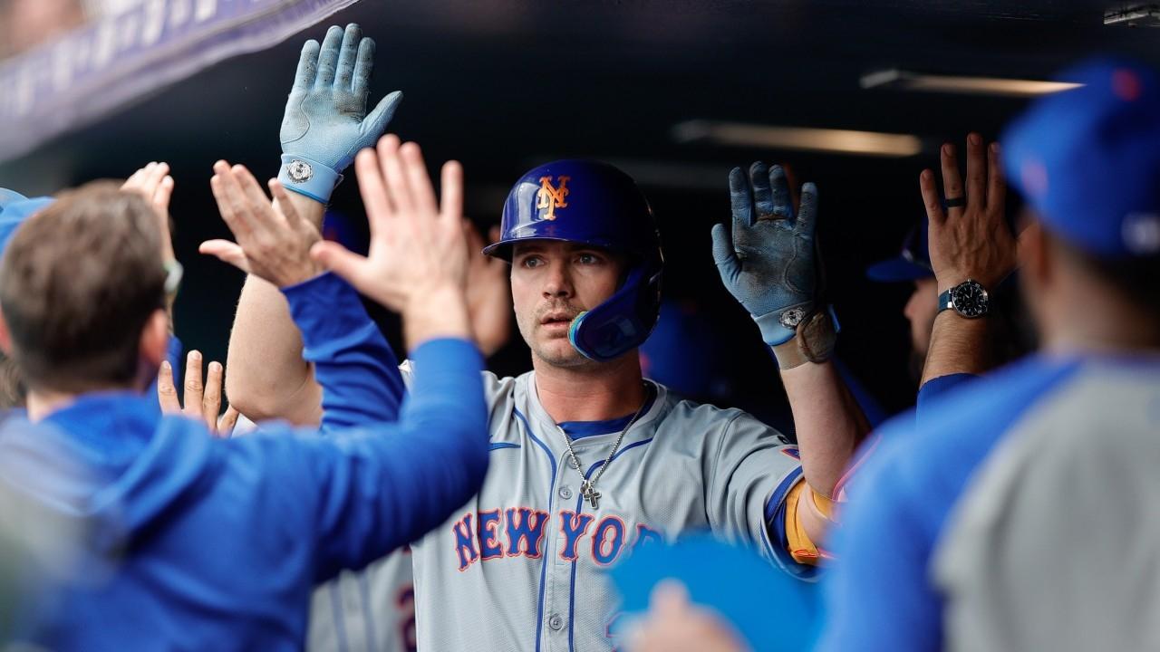 New York Mets first baseman Pete Alonso (20) celebrates in the dugout on a two run home run in the first inning against the Colorado Rockies at Coors Field.