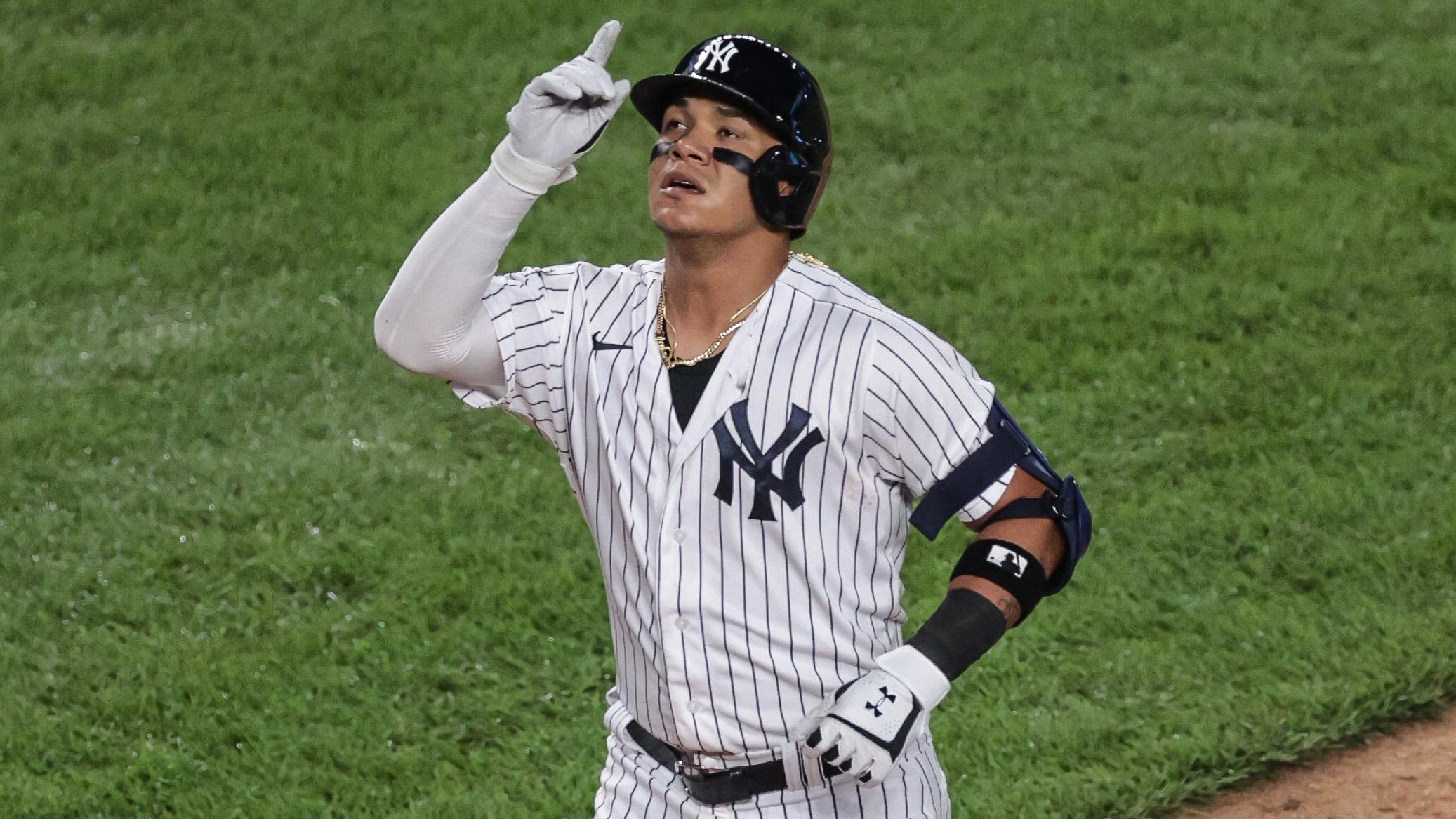 New York Yankees third base man Thairo Estrada (71) reacts after his solo home run during the fourth inning against the Boston Red Sox at Yankee Stadium.