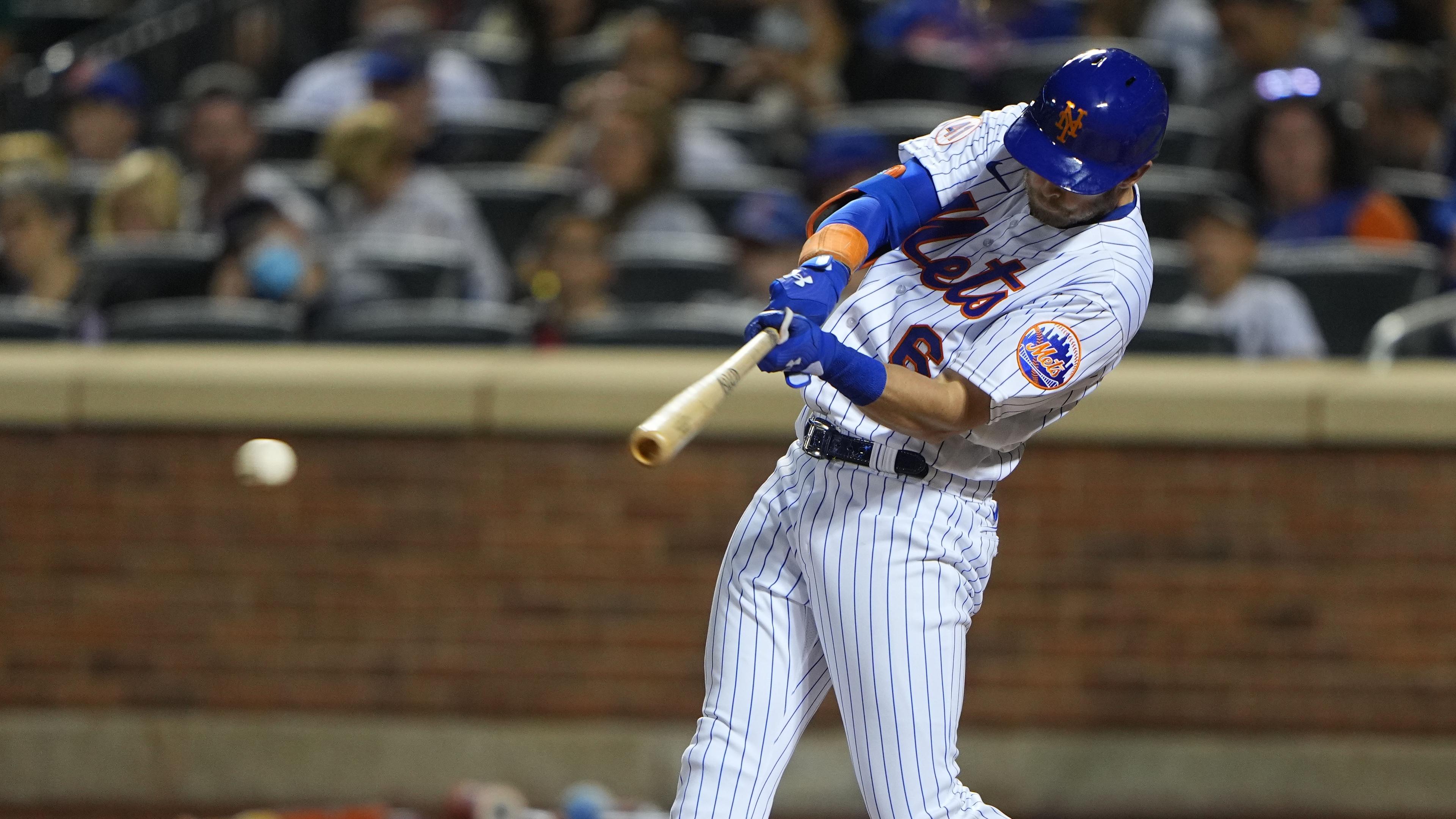 Sep 19, 2021; New York City, New York, USA; New York Mets left fielder Jeff McNeil (6) hits a single during the fifth inning against the Philadelphia Phillies at Citi Field.