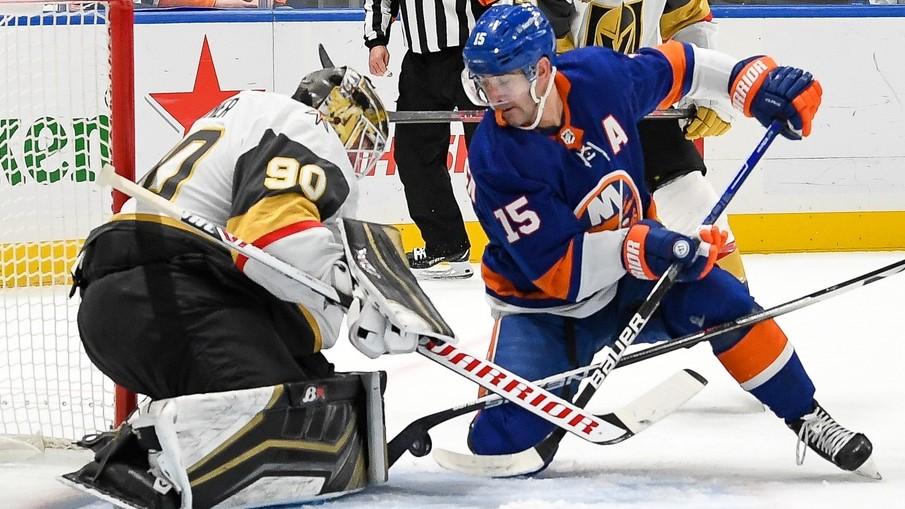 Dec 19, 2021; Elmont, New York, USA; Vegas Golden Knights goaltender Robin Lehner (90) makes a save 0n New York Islanders right wing Cal Clutterbuck (15) during the second period at UBS Arena.