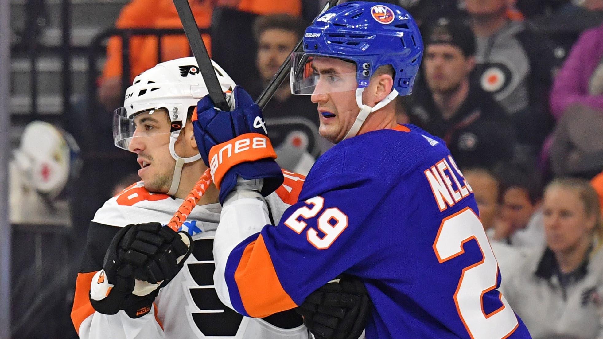 Philadelphia Flyers center Morgan Frost (48) and New York Islanders center Brock Nelson (29) battle for position during the second period at Wells Fargo Center / Eric Hartline - USA TODAY Sports